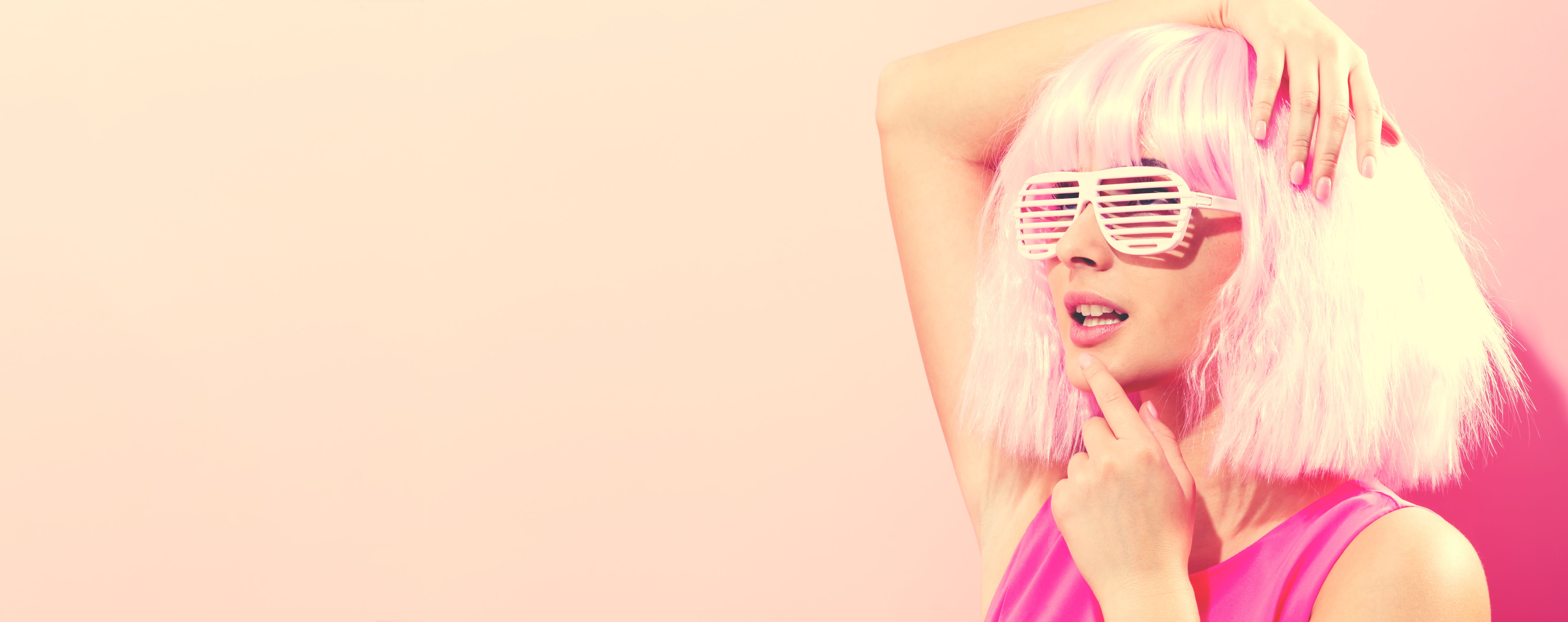 Beautiful woman in a bright pink wig
