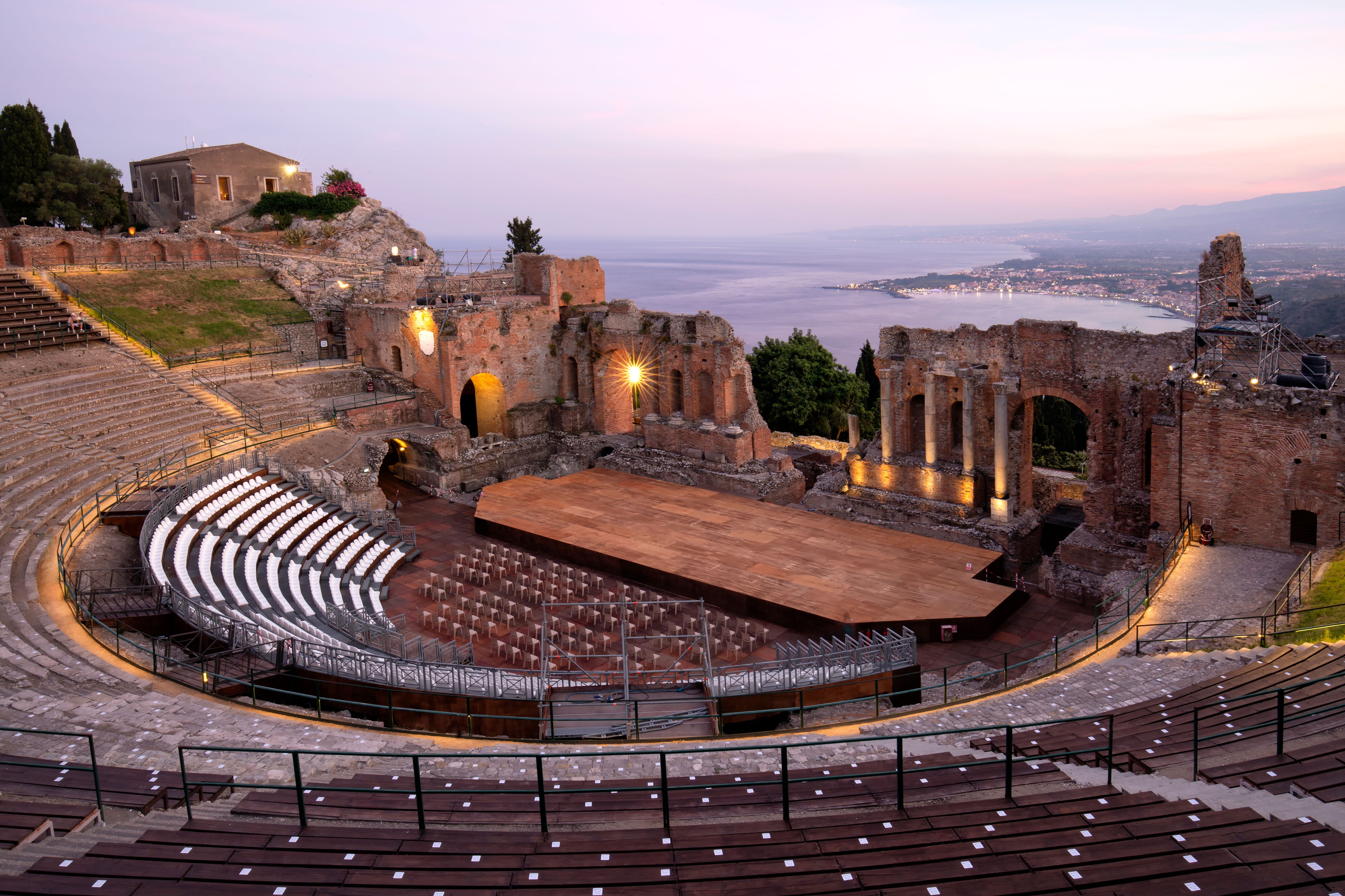 Teatro Antico di Taormina with view over the bay and Mount Etna in the background. Remains of the Greco-Roman theatre Teatro Antico di Taormina with view over the bay and Mount Etna in the background. Remains of the Greco-Roman theatre