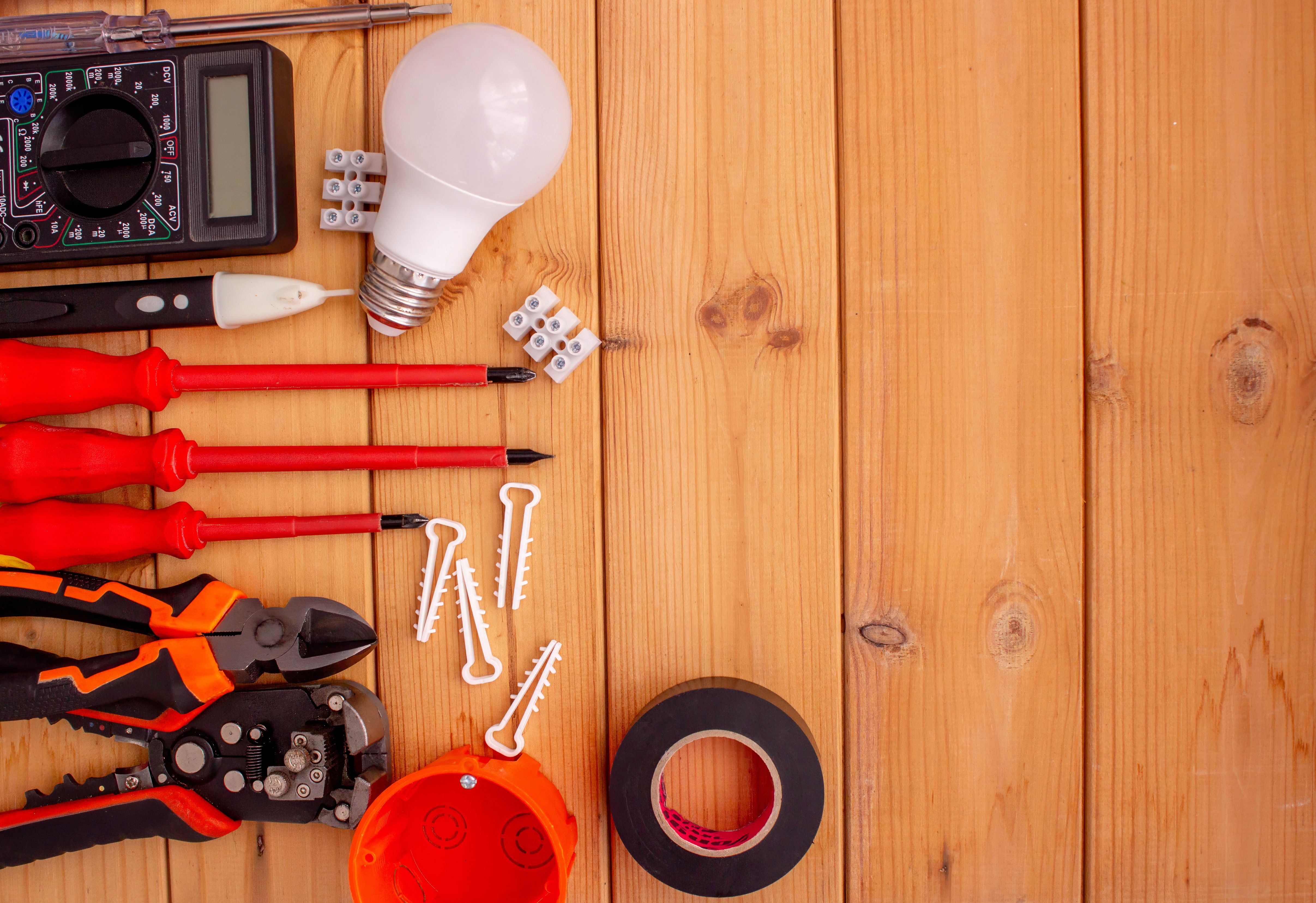 Electrical Tools and Components on Wooden Background