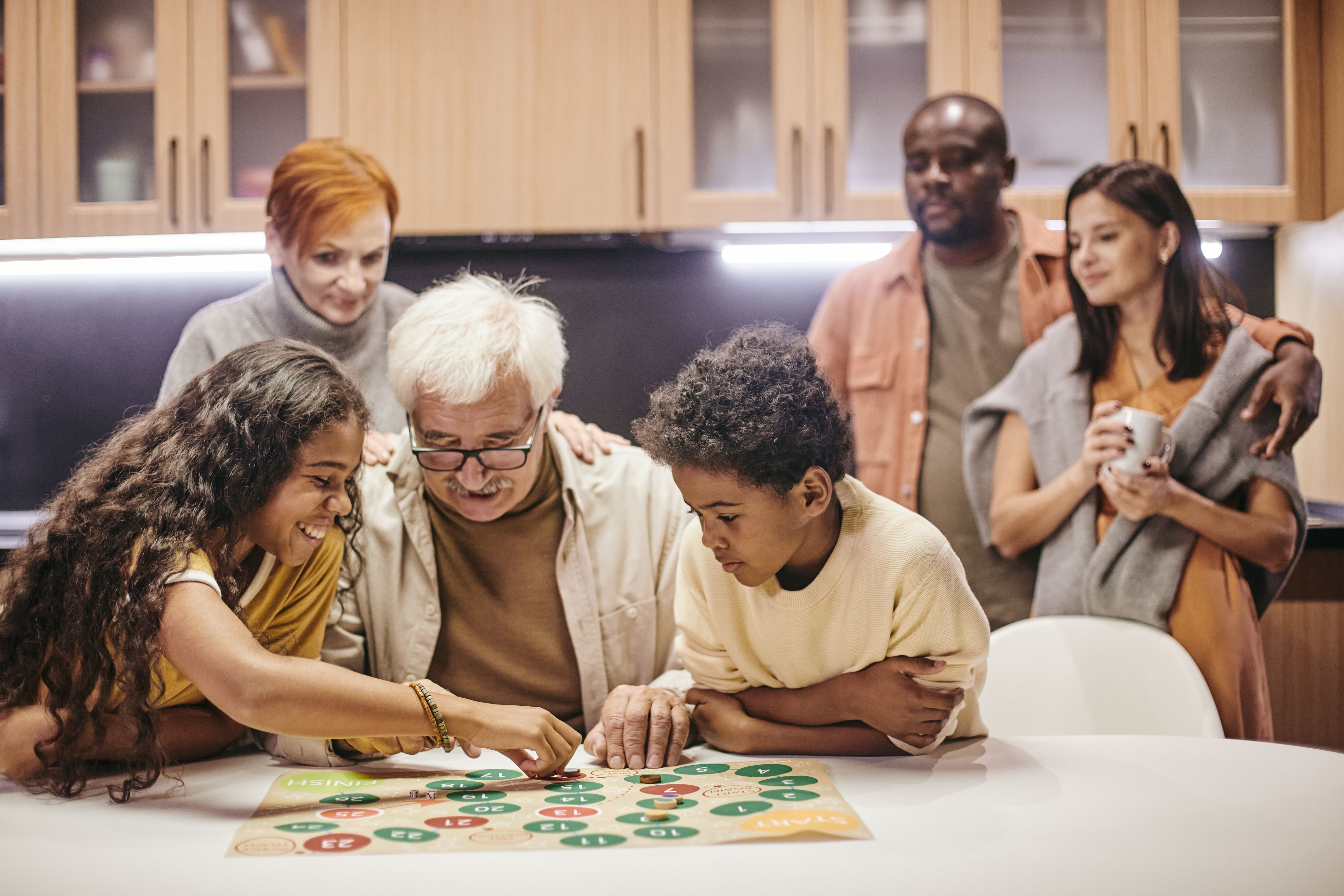 family playing board game
