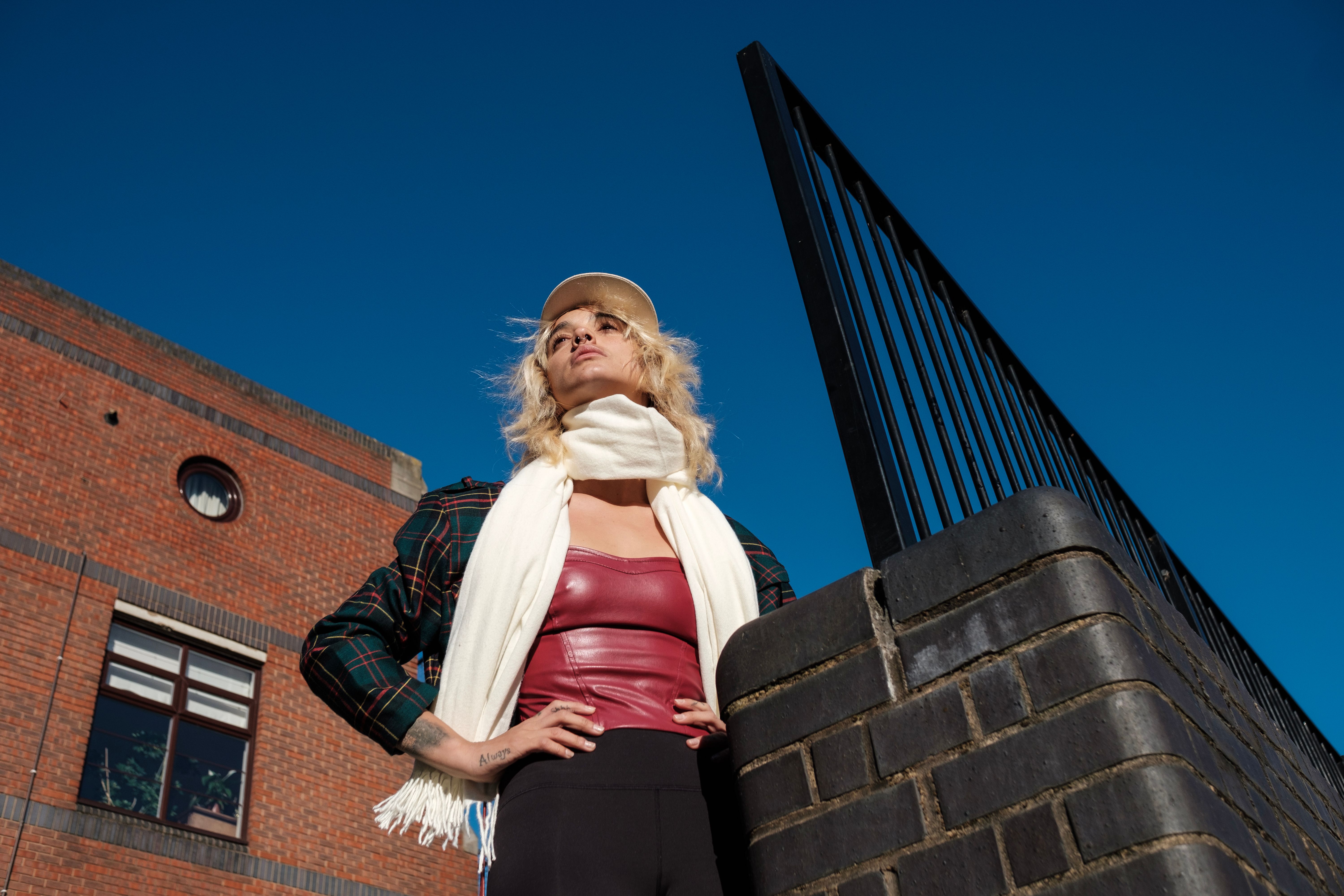 Portrait of modern alternative young woman posing in an urban environment in a sunny day. Portrait of modern alternative young woman posing in an urban environment in a sunny day.