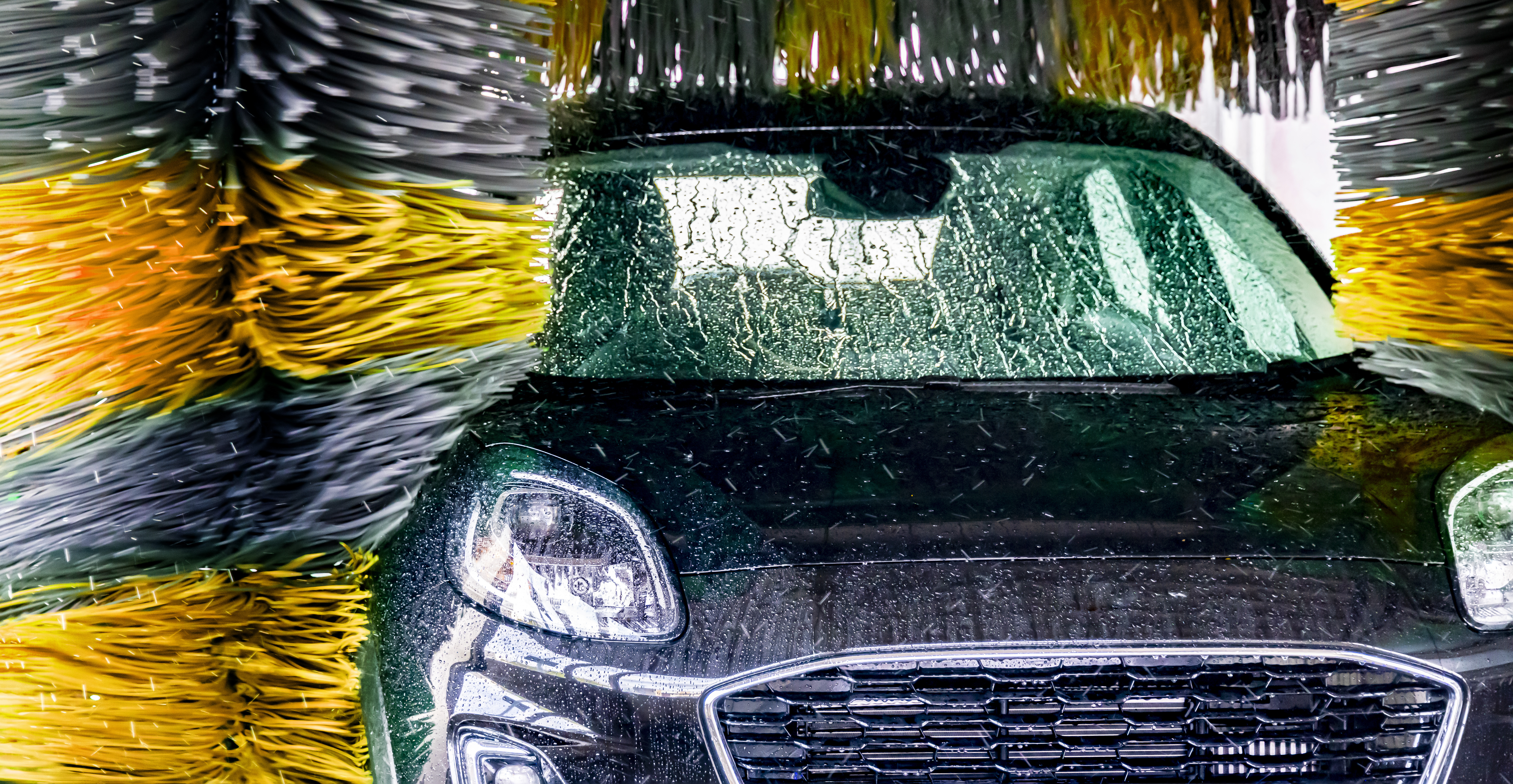 A vehicle in an automatic car wash