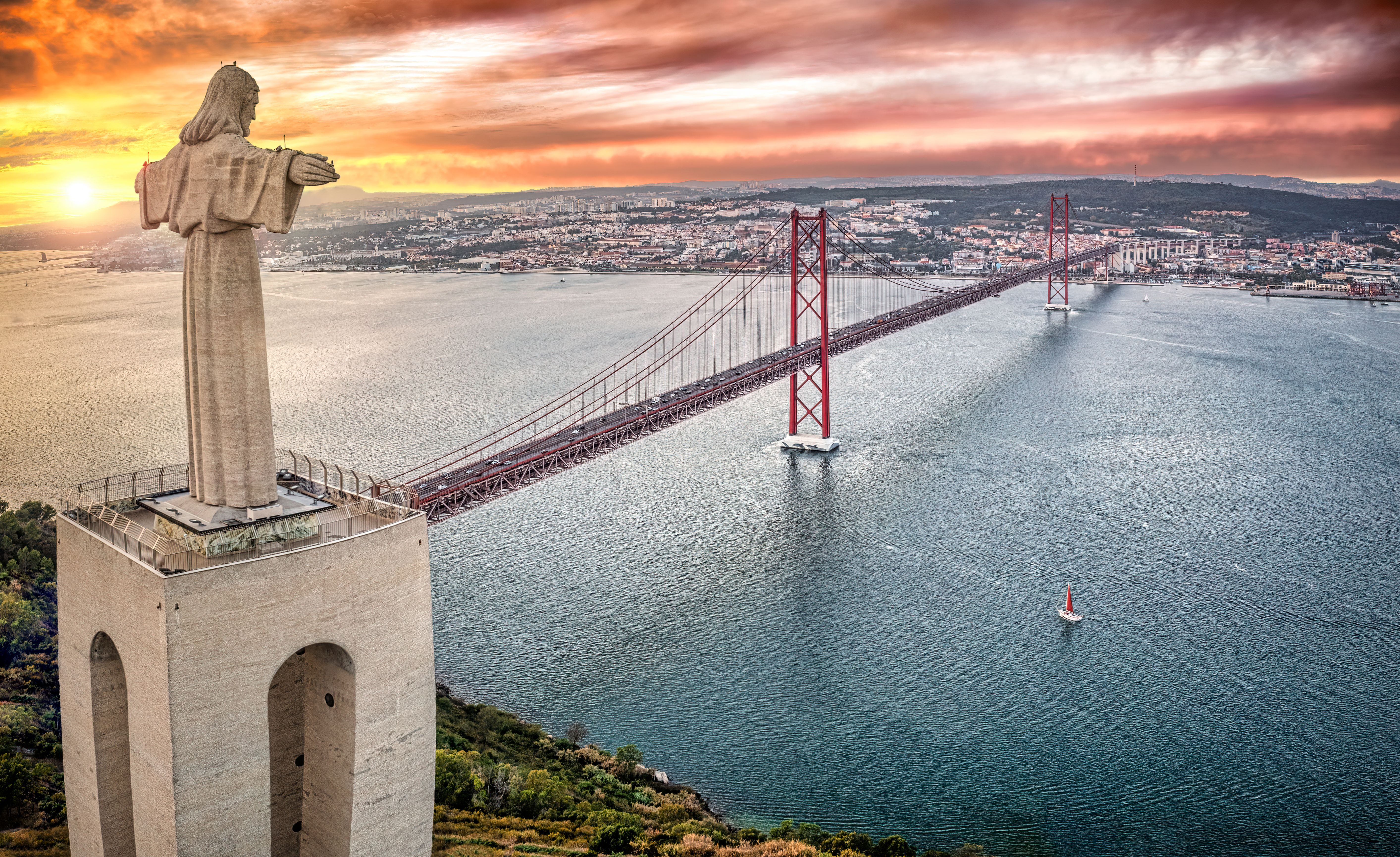 Cristo Rei statue and April 25th Bridge at sunset, Almada, Lisboa Region, Portugal
