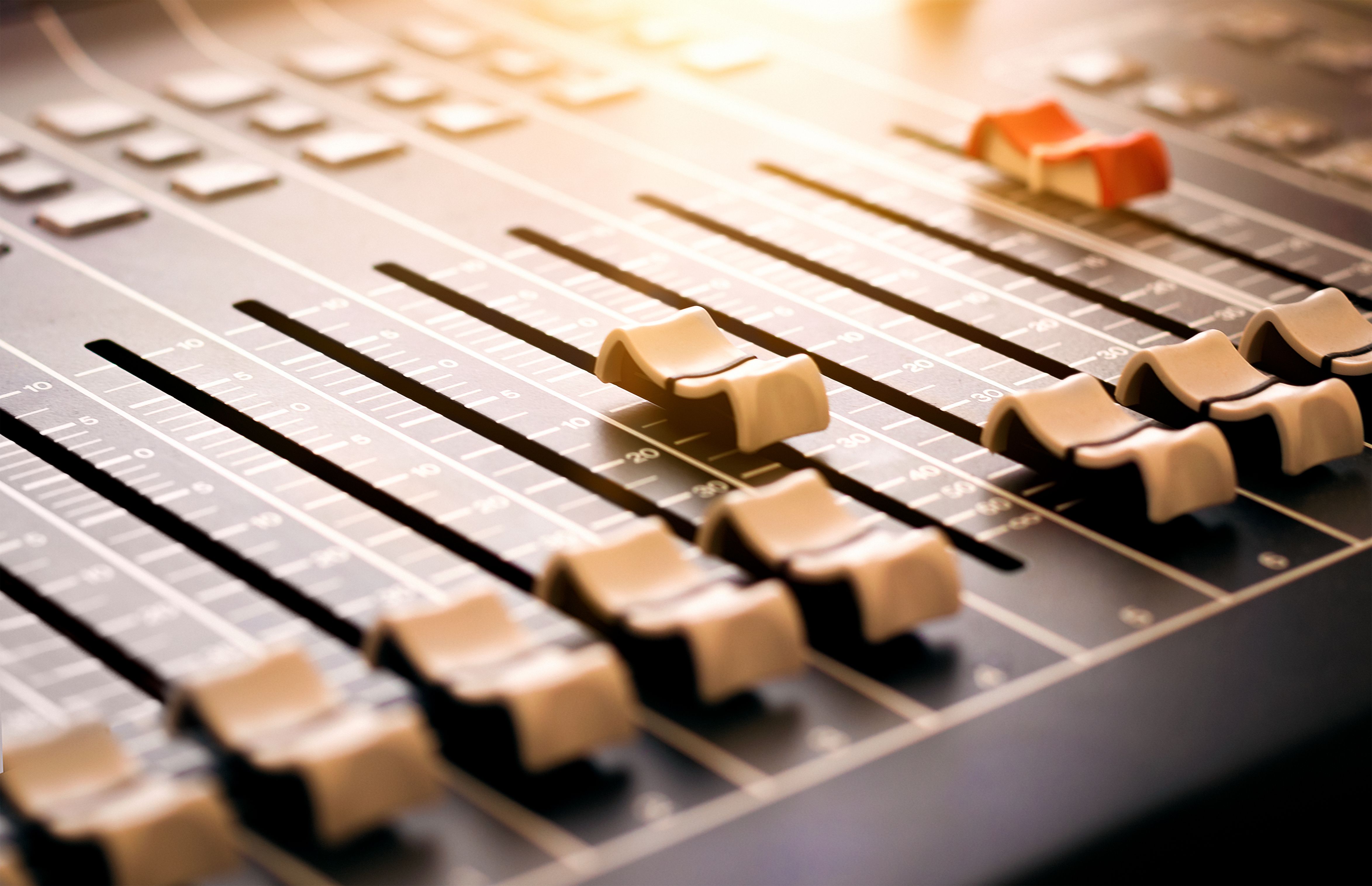 Mixing desk faders close up