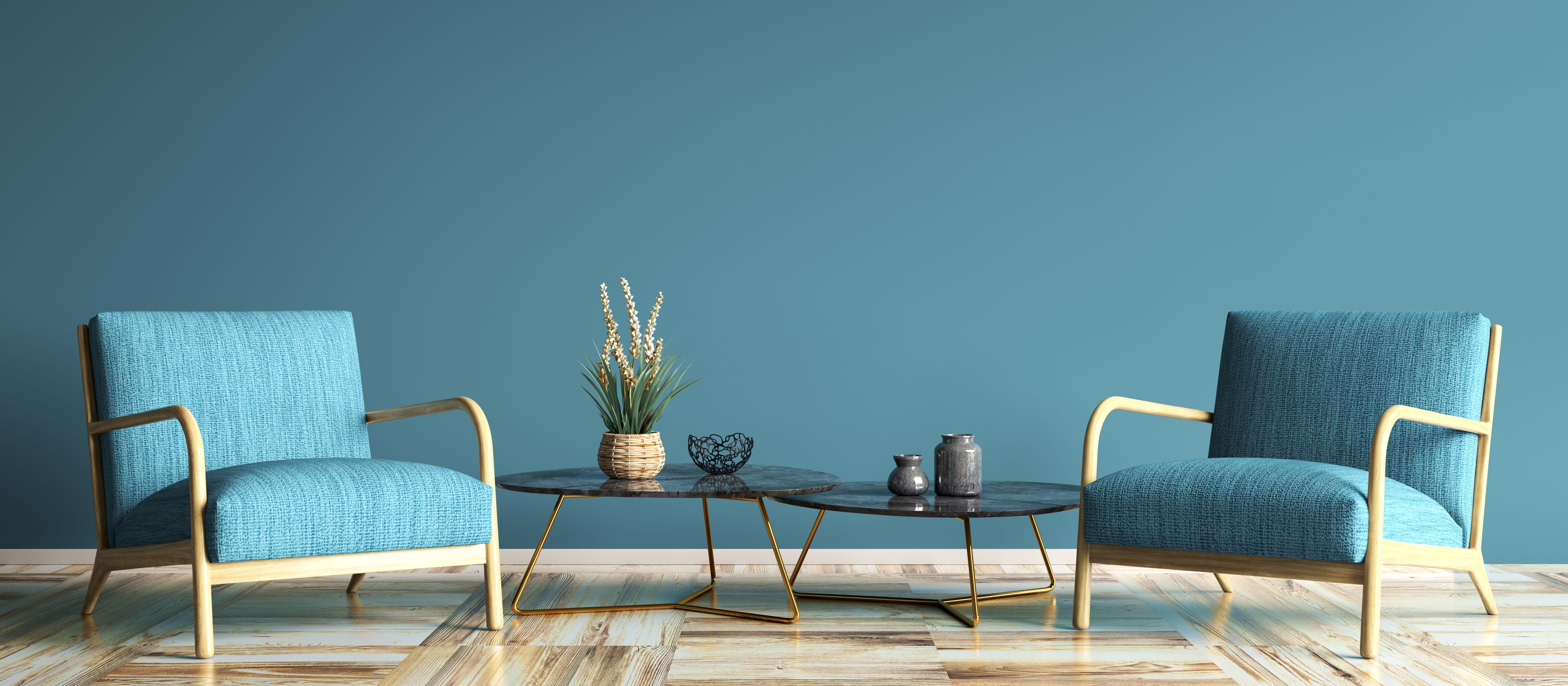 Interior with blue armchairs and set of two coffee tables in modern living room, home design 3d rendering Interior with blue armchairs and set of two coffee tables in modern living room, home design 3d rendering