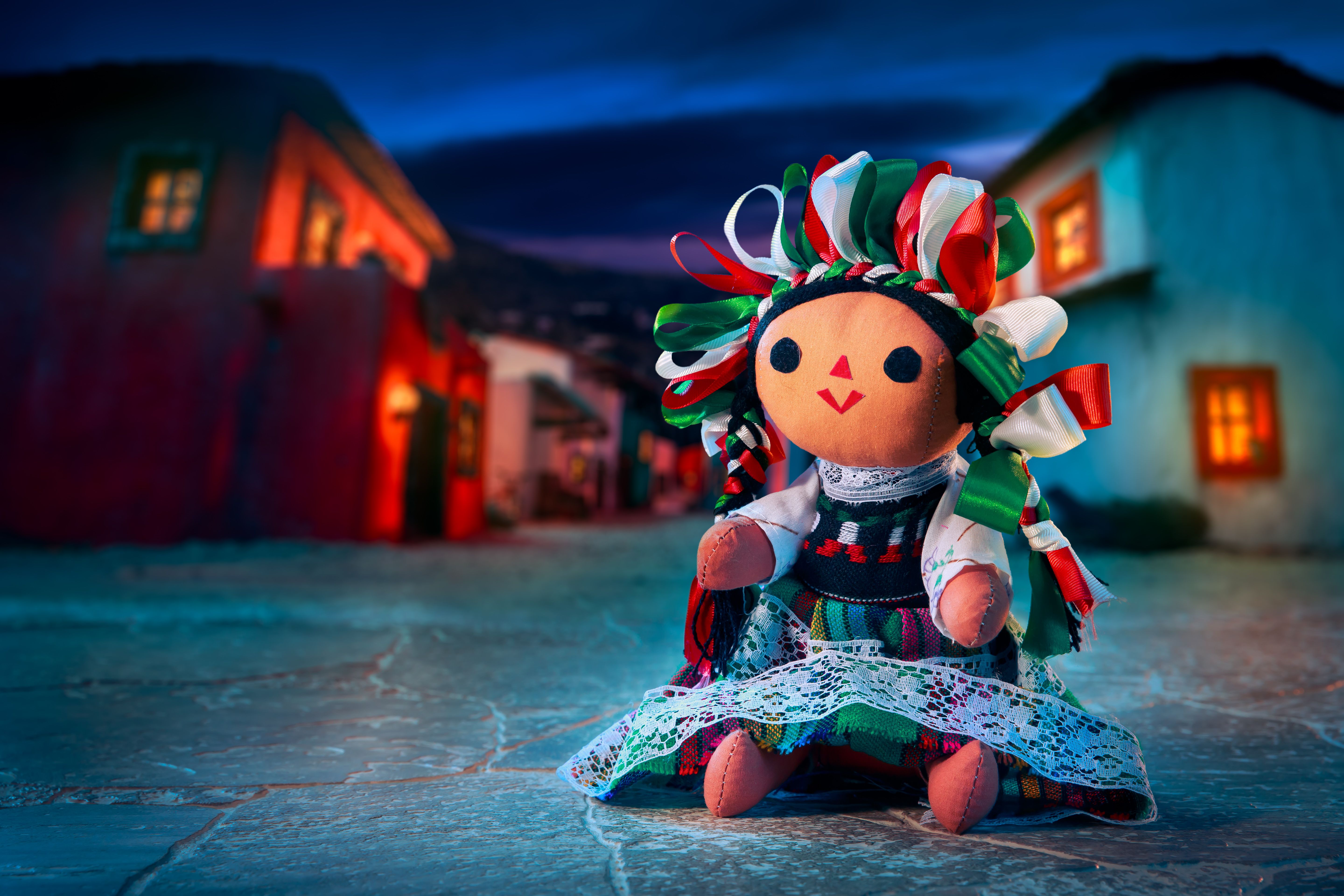 Mexican rag doll in a traditional dress at night
