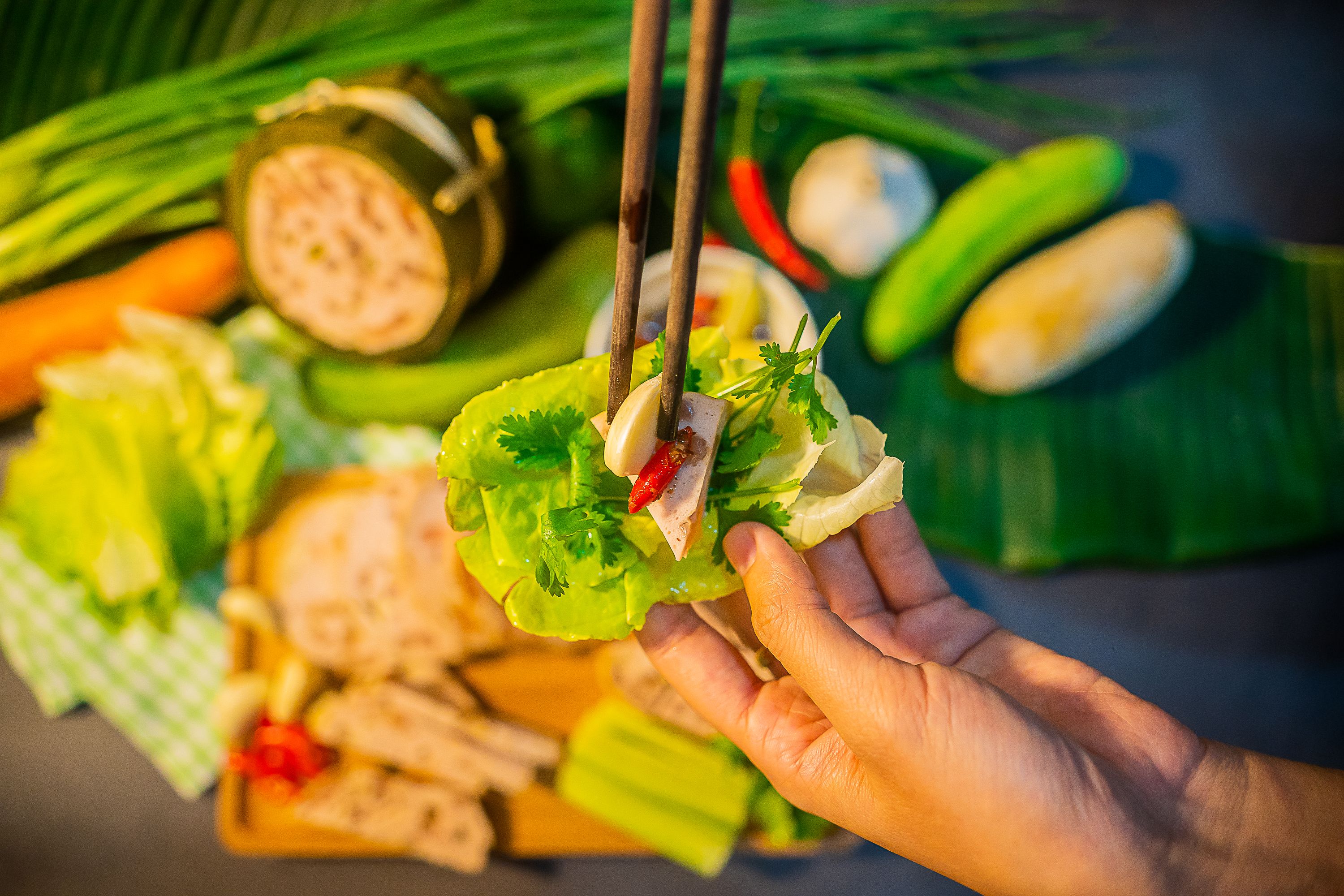 Traditional Vietnamese food, pork sausage or pork bologna with pepper, lemon and salt sauce on colorful background