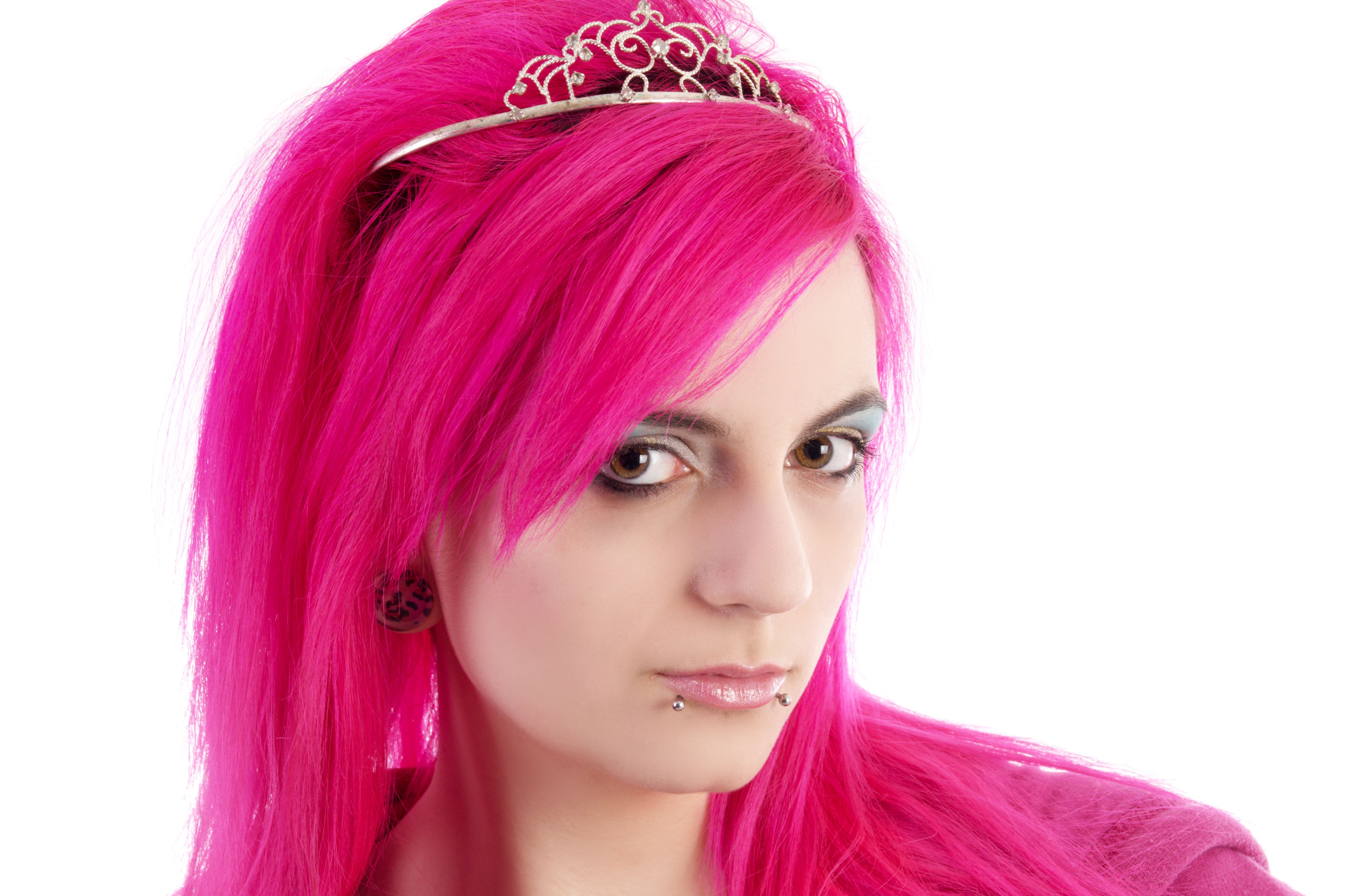 Pink haired beauty in semi-profile.