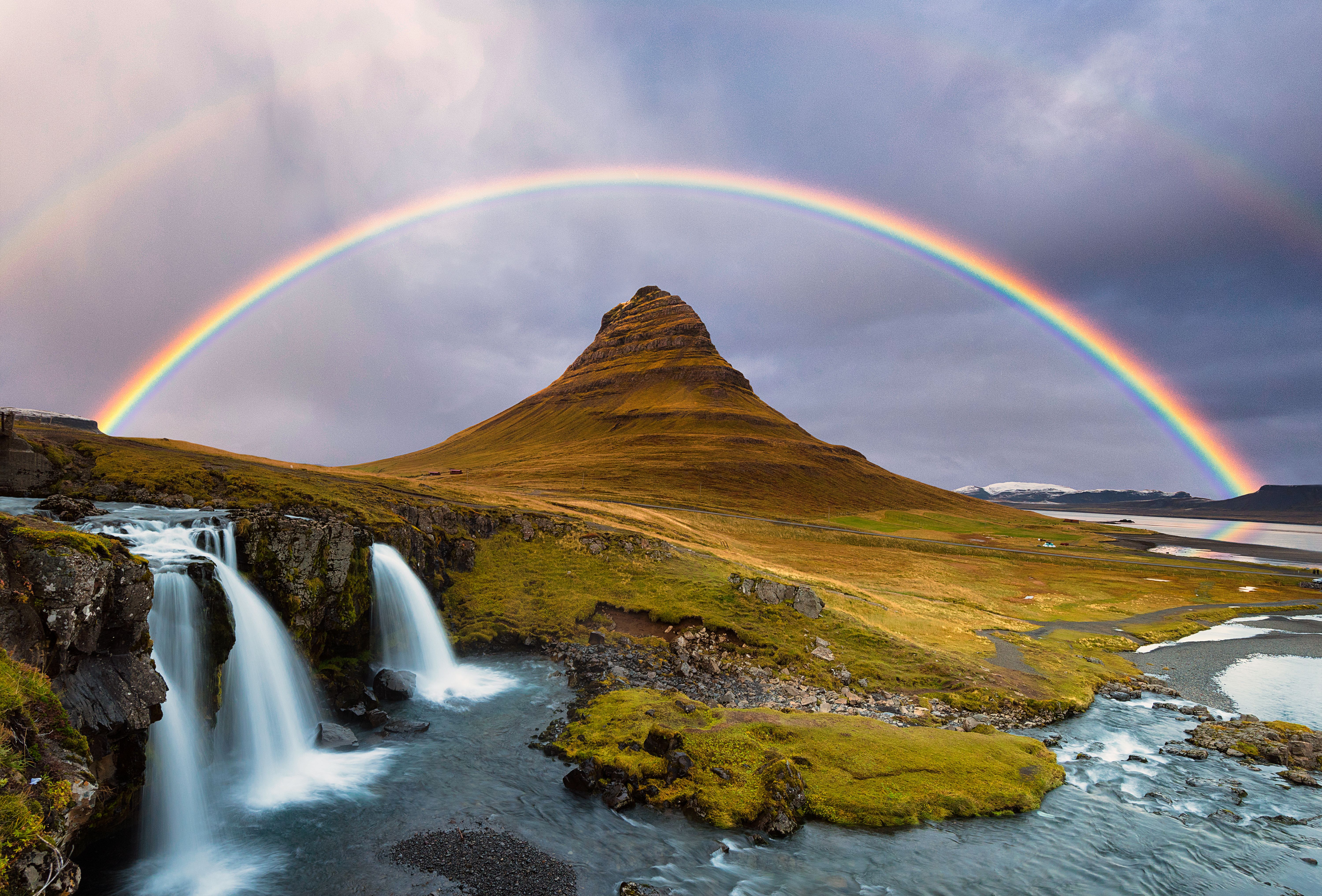 Kirkjufell Mountain and Kirkjufellsfoss Waterfalls Against the Rainbow,  Autumn.