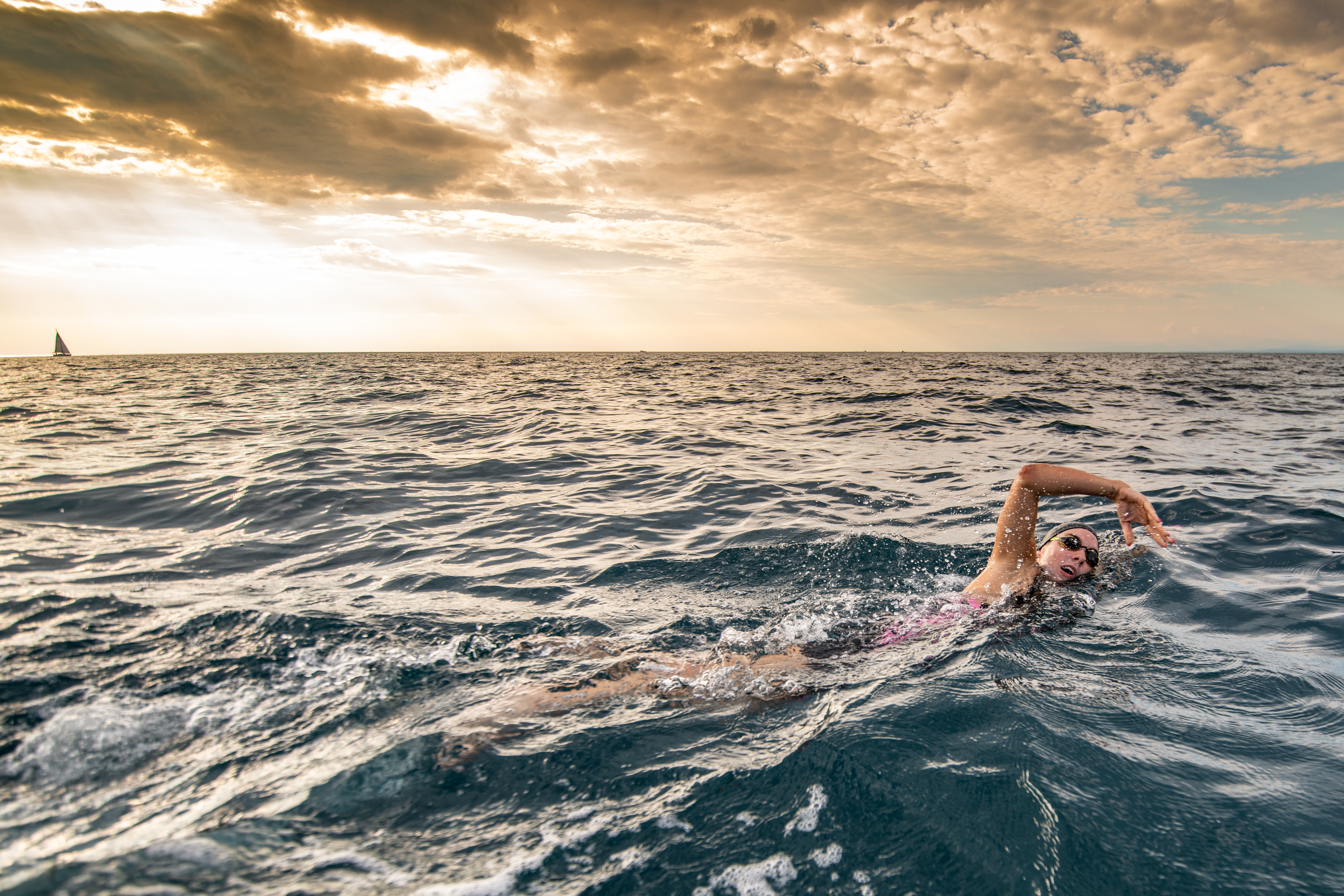 Open water swimmer swimming in sea