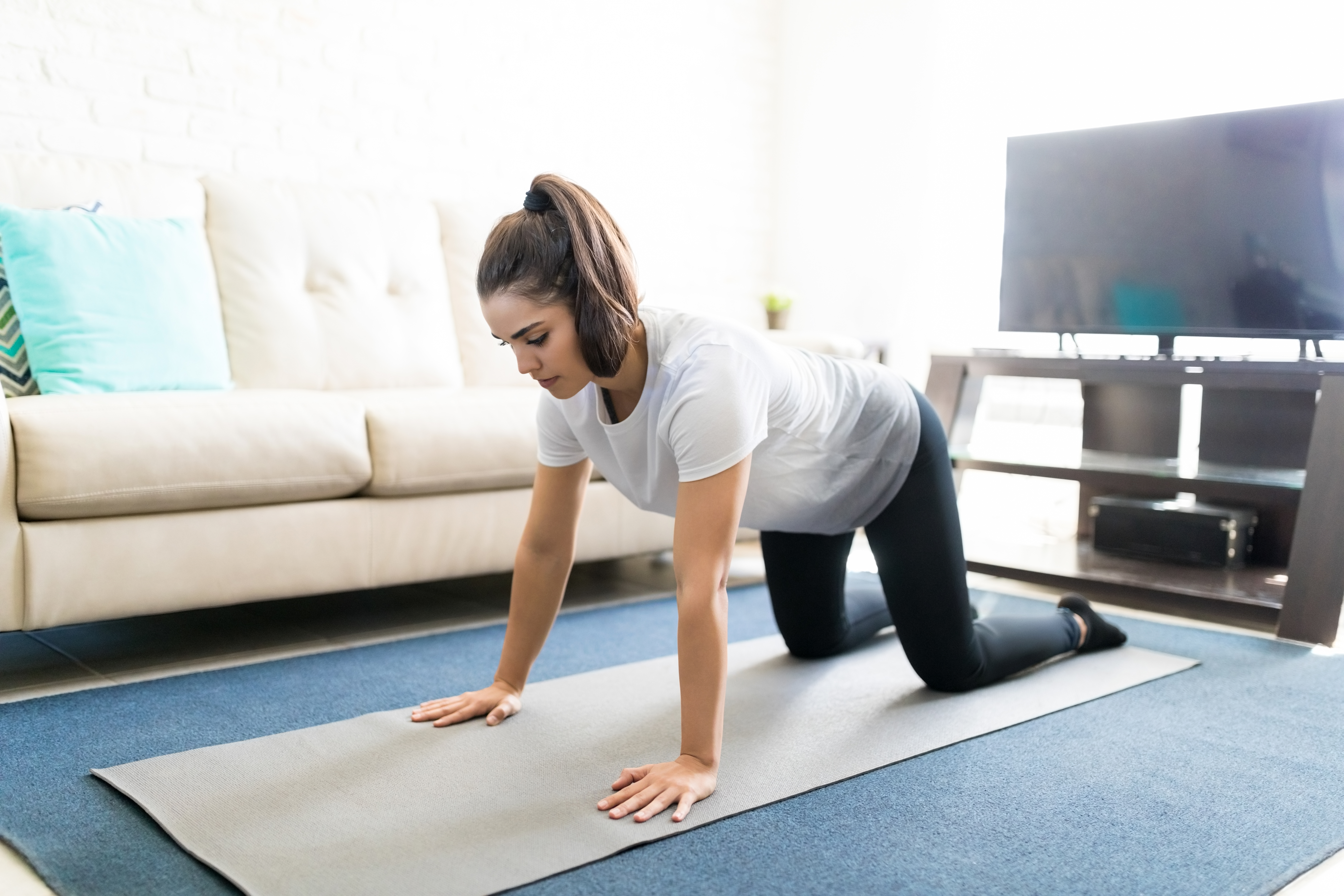 Healthy woman exercising at home Healthy woman exercising at home