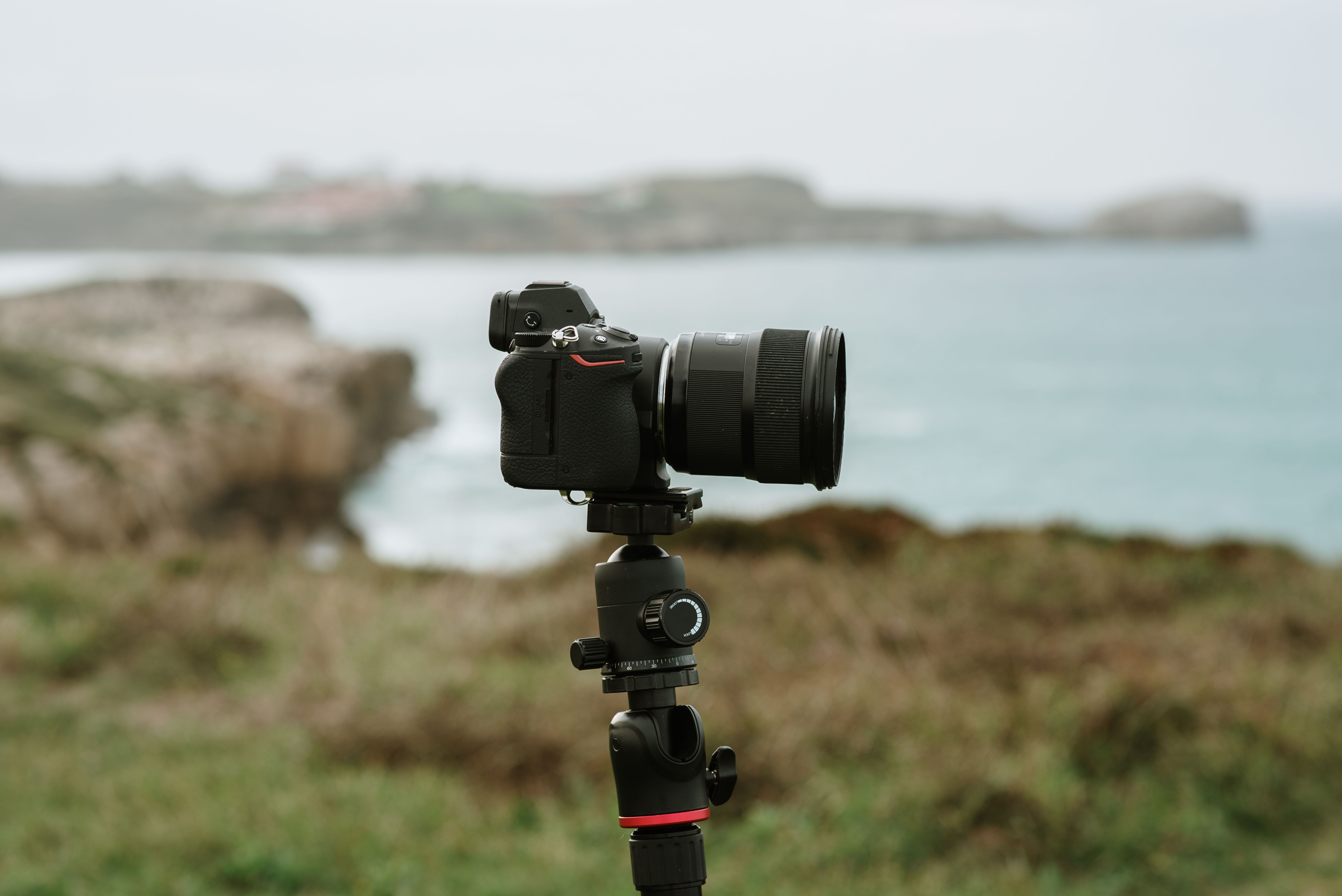 Modern mirrorless digital camera on a tripod