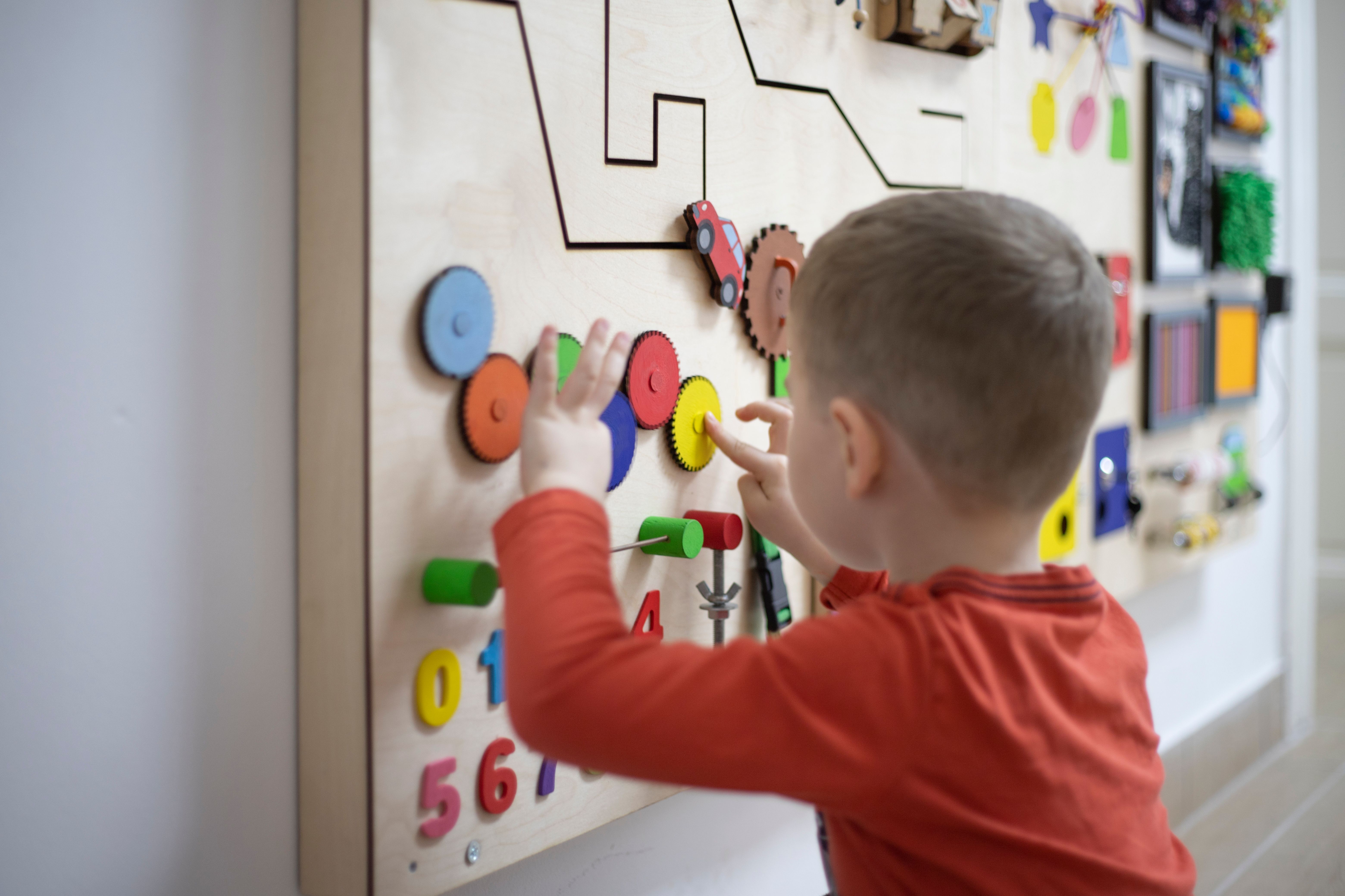 Boy playing with the interactive board