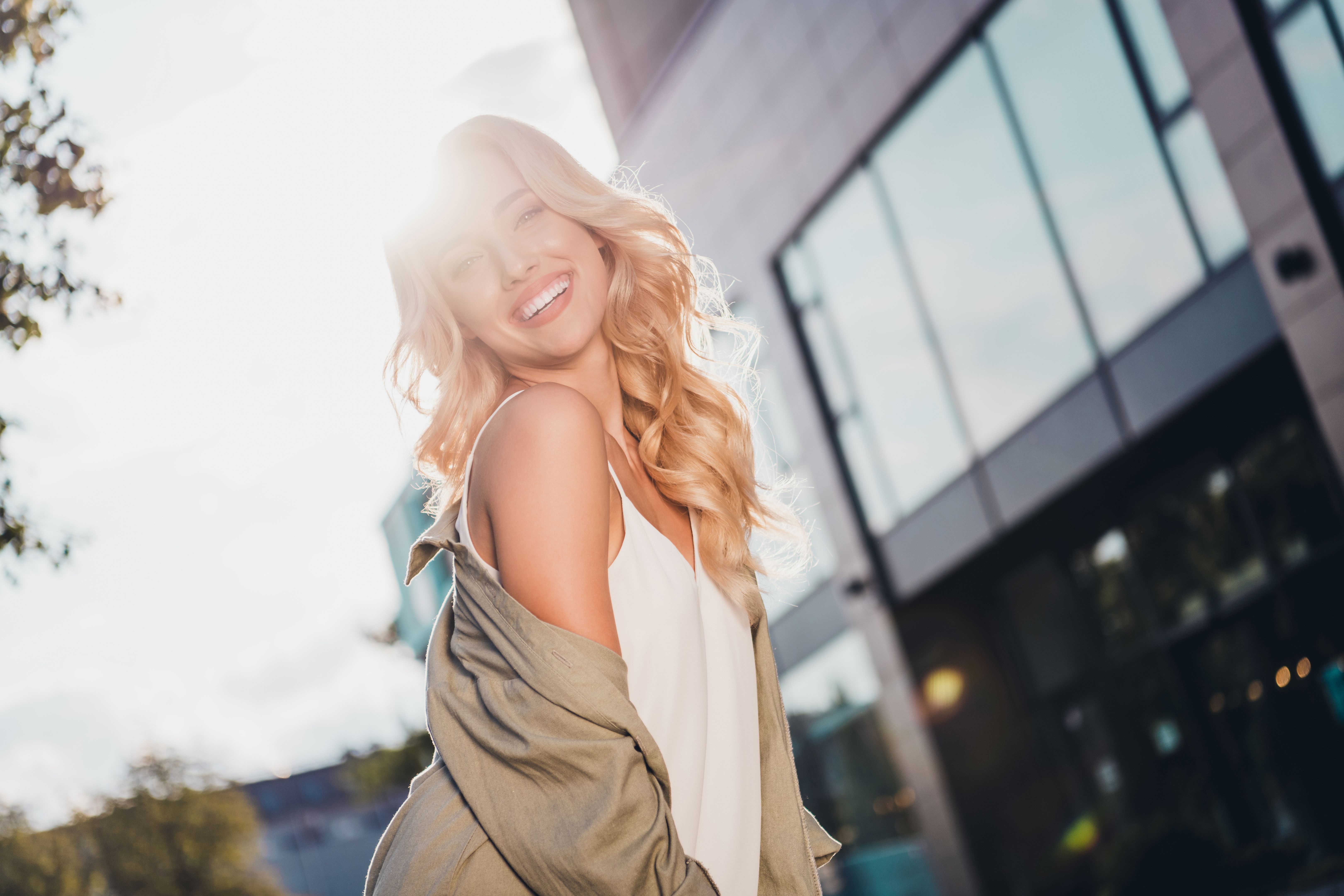 Portrait of attractive cheerful dreamy lovely cute wavy haired girl spending sunny day weekend having fun strolling outside Portrait of attractive cheerful dreamy lovely cute wavy haired girl spending sunny day weekend having fun strolling outside