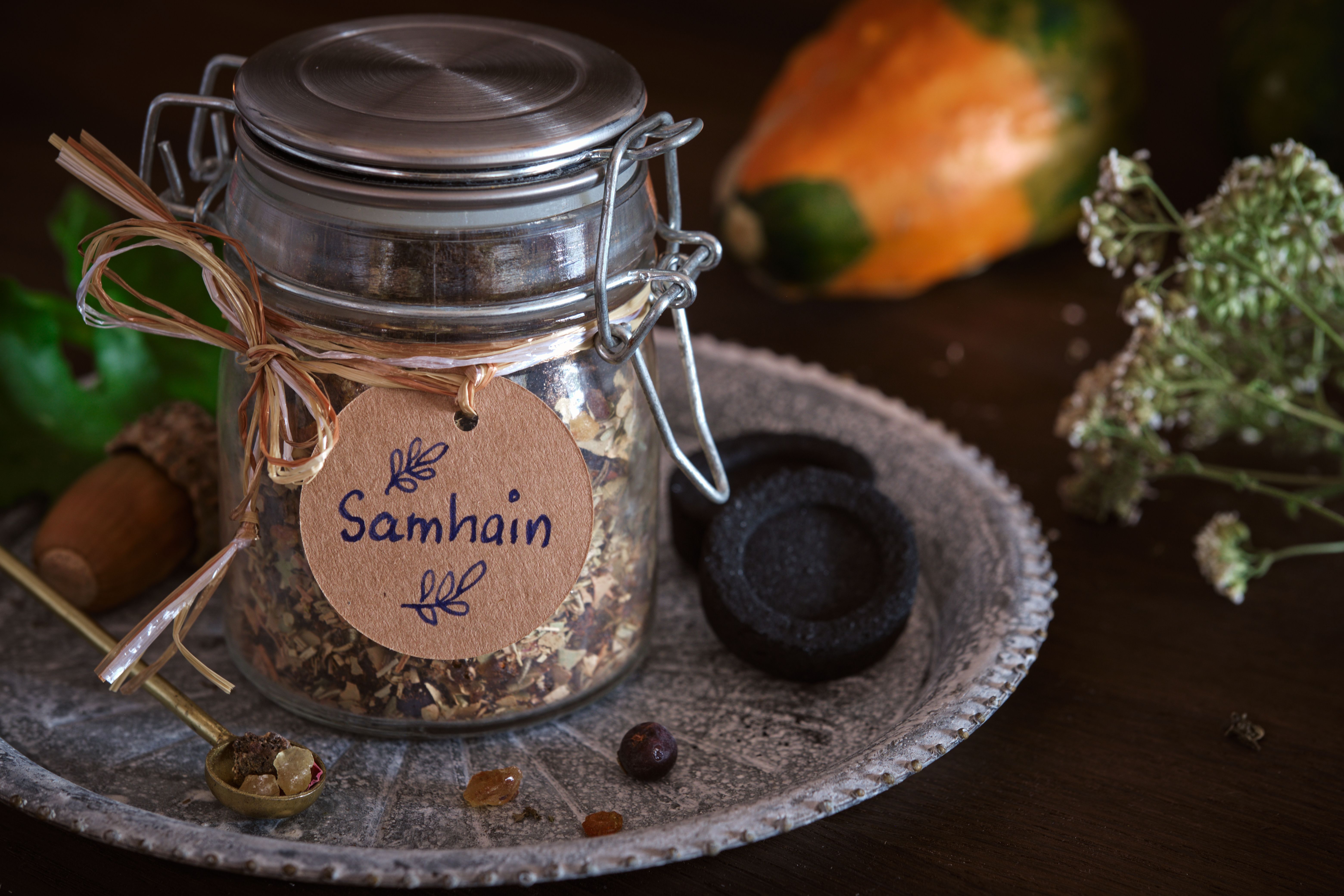 Incense mixture for Samhain in a jar (frankincense, copal, myrrh, cedarwood, rosemary). Samhain is a celtic seasonal festival marking the beginning of winter.