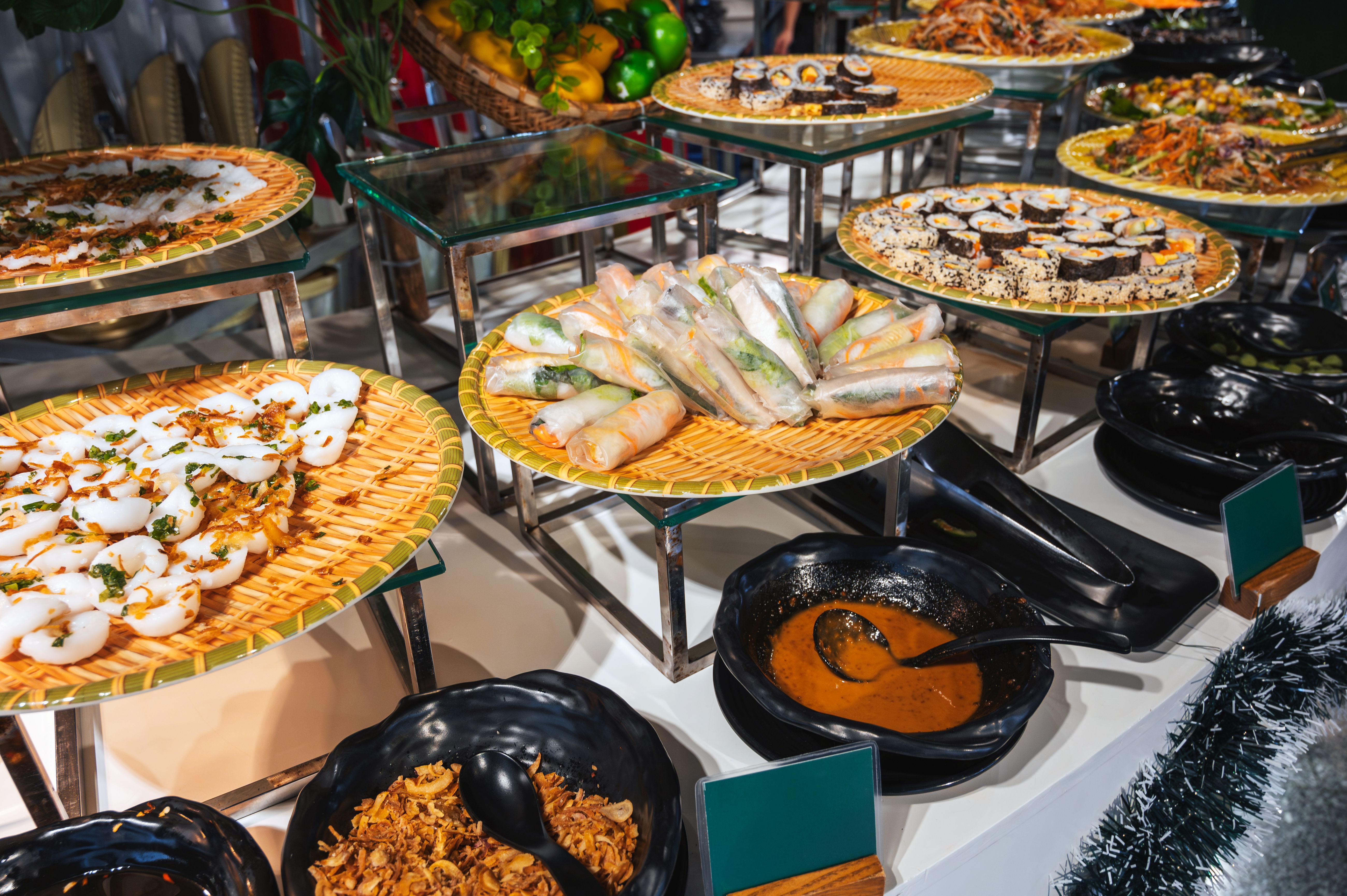 traditional Asian buffet food in restaurant in Asia. Vietnamese spring rolls and rolls in hotel for breakfast