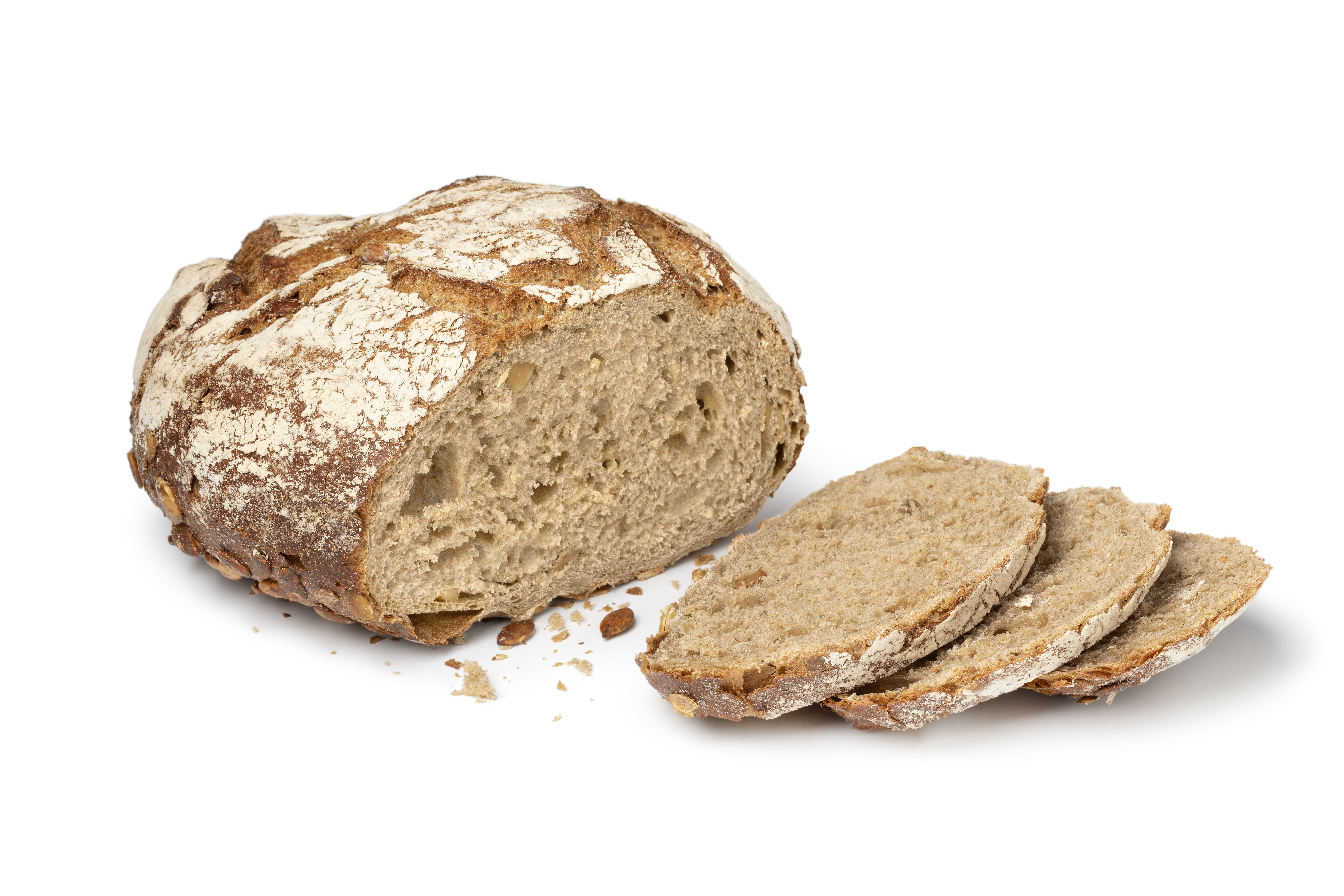 Sourdough loaf of bread with pumpkin seeds and slices close up on white background