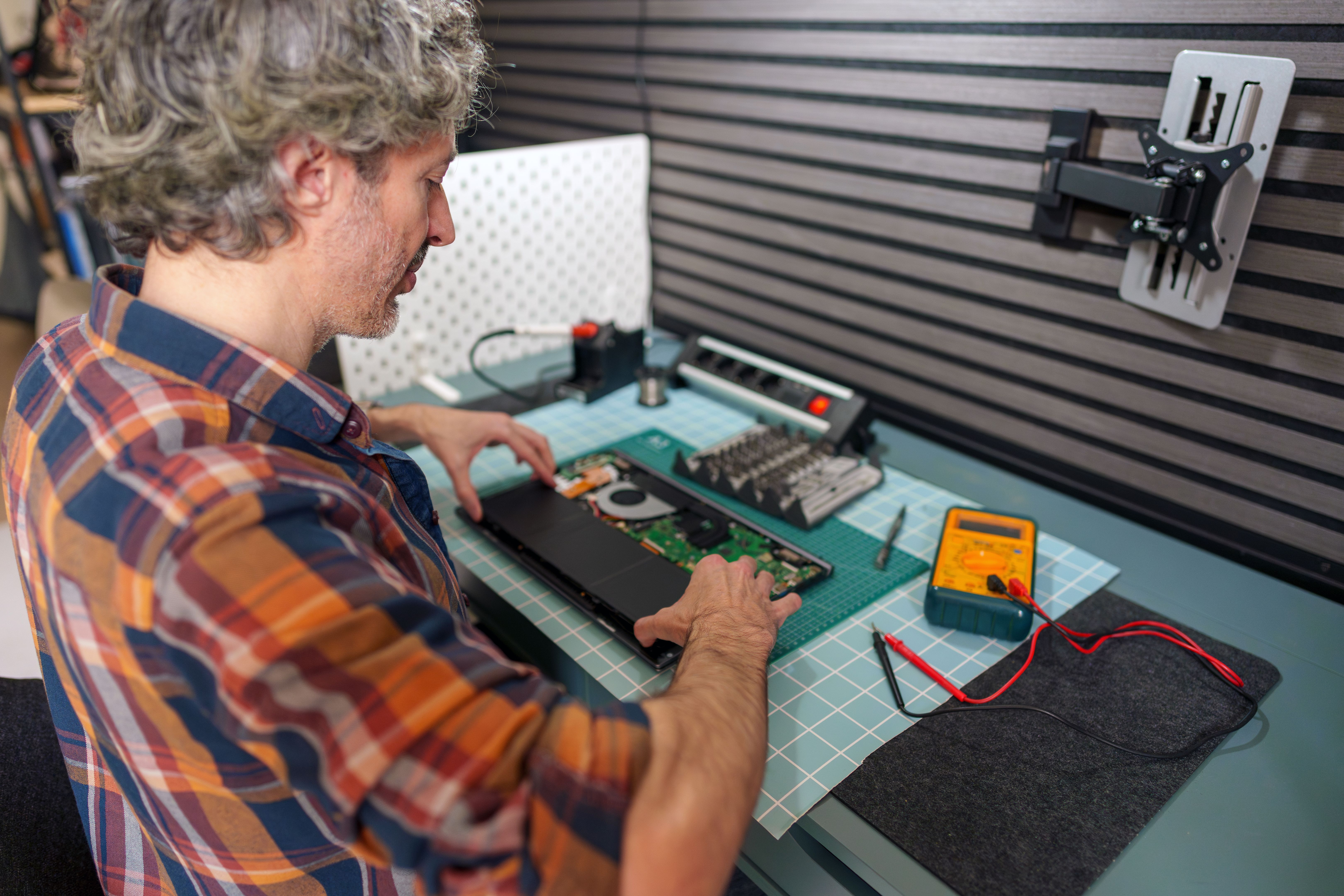 technician repairing laptop