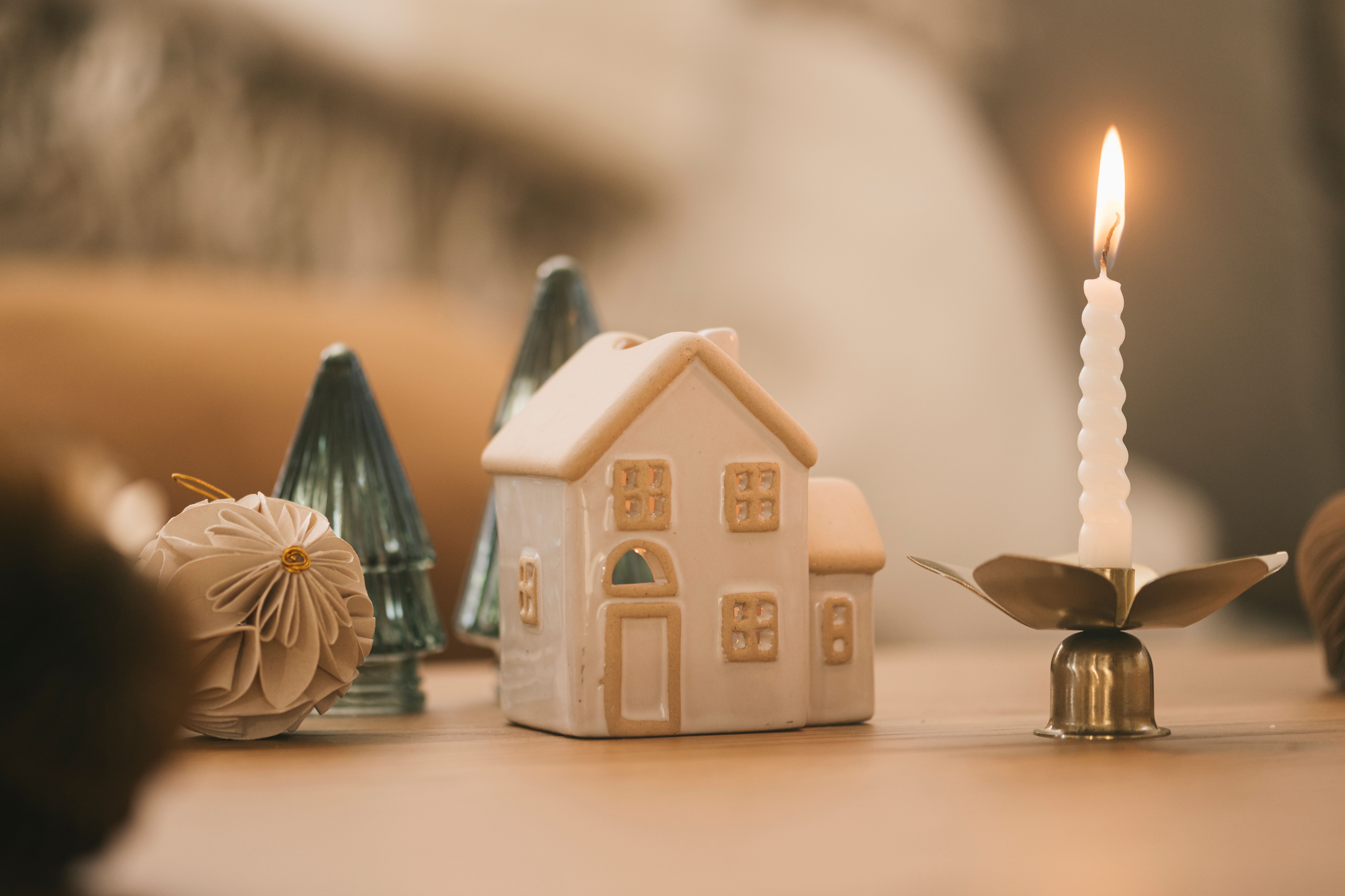 Christmas still life candles and house decorations and ornaments