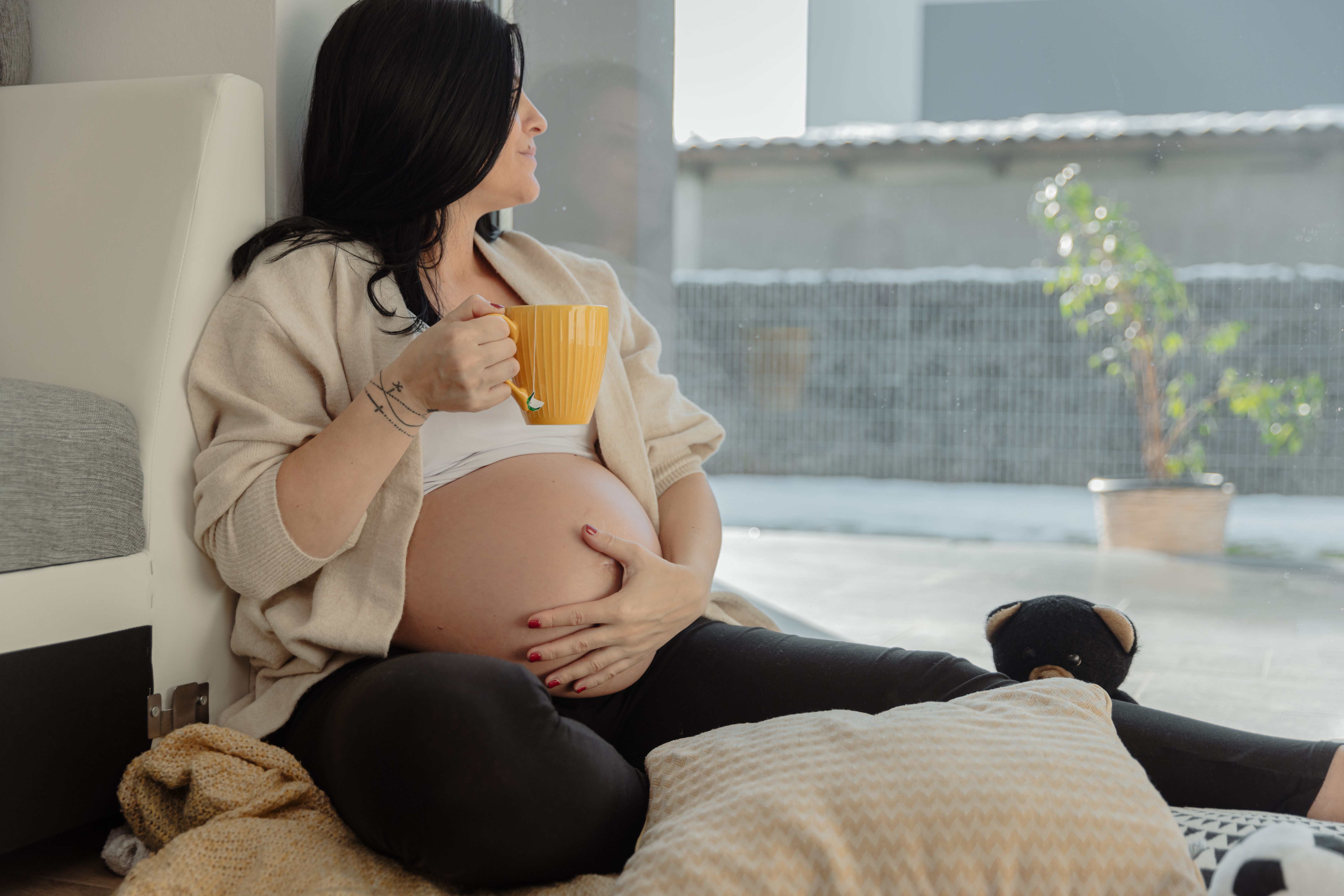 Midwife providing IV fluids for pregnant woman with Hyperemesis Gravidarum