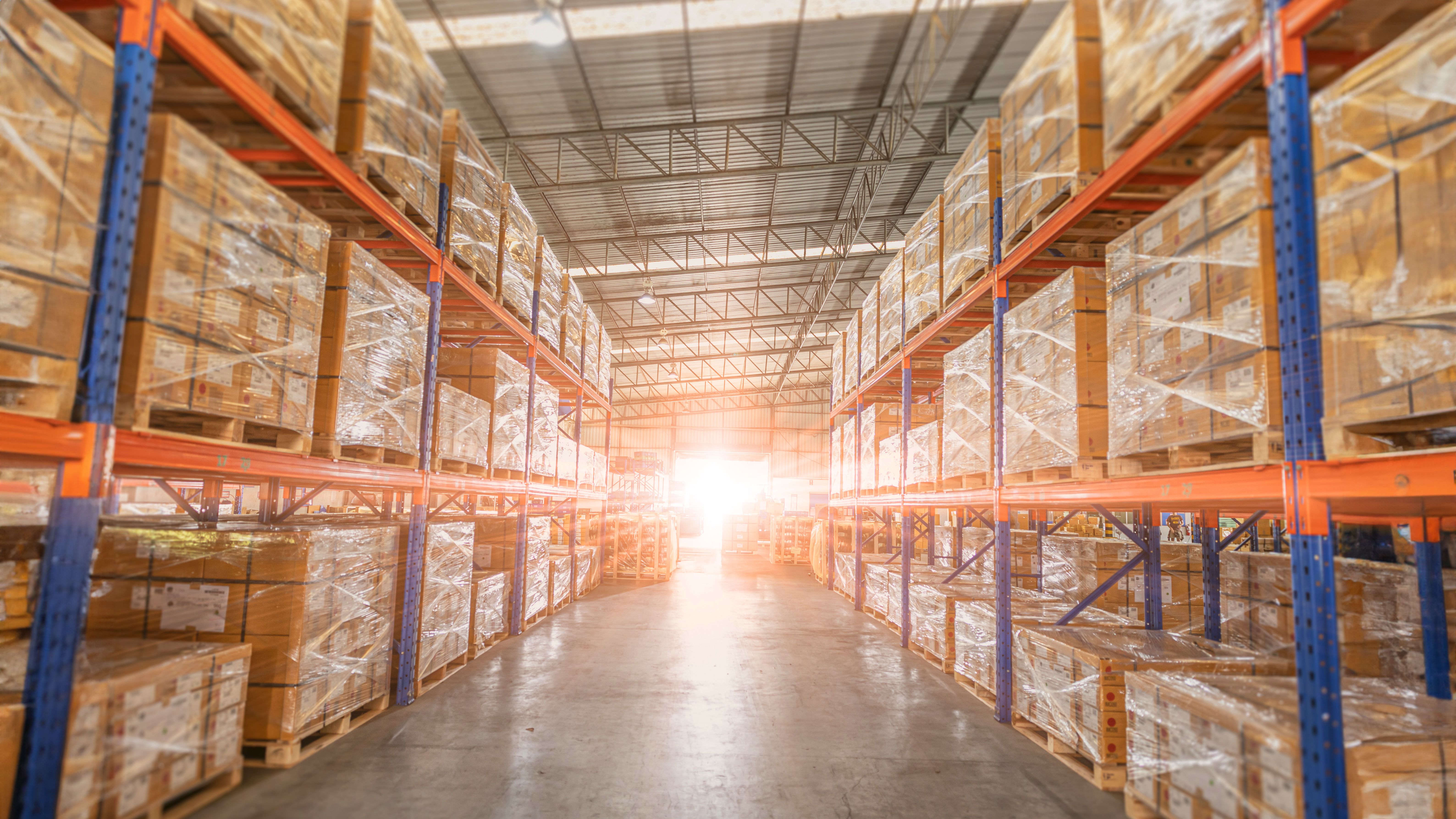 Full of goods stock in warehouse industrial and logistics background. Commercial Storage area. Large products distribution Inventory cargo shelves.