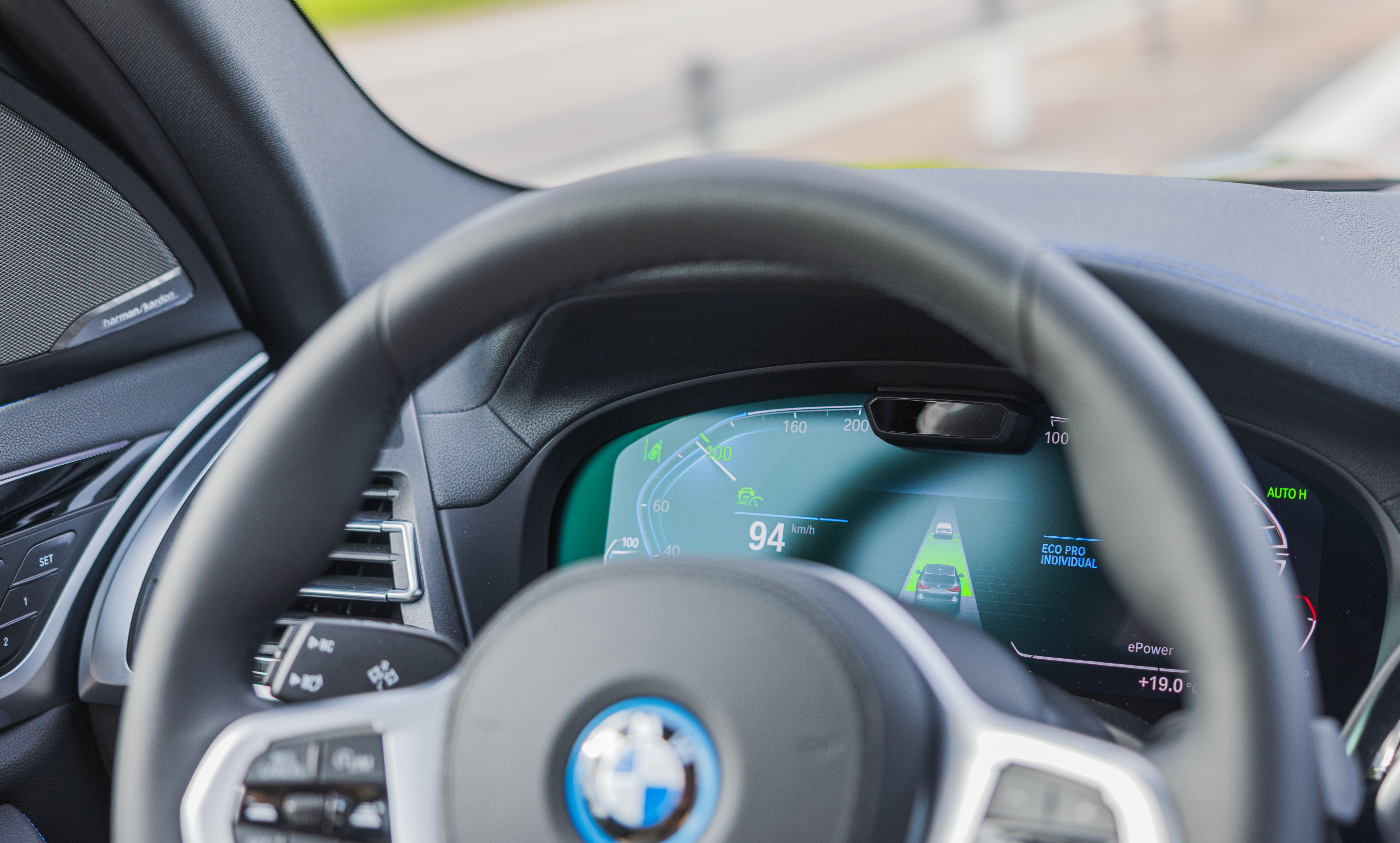 View of speedometer design moving car on new BMW iX3 M-sport electric car.