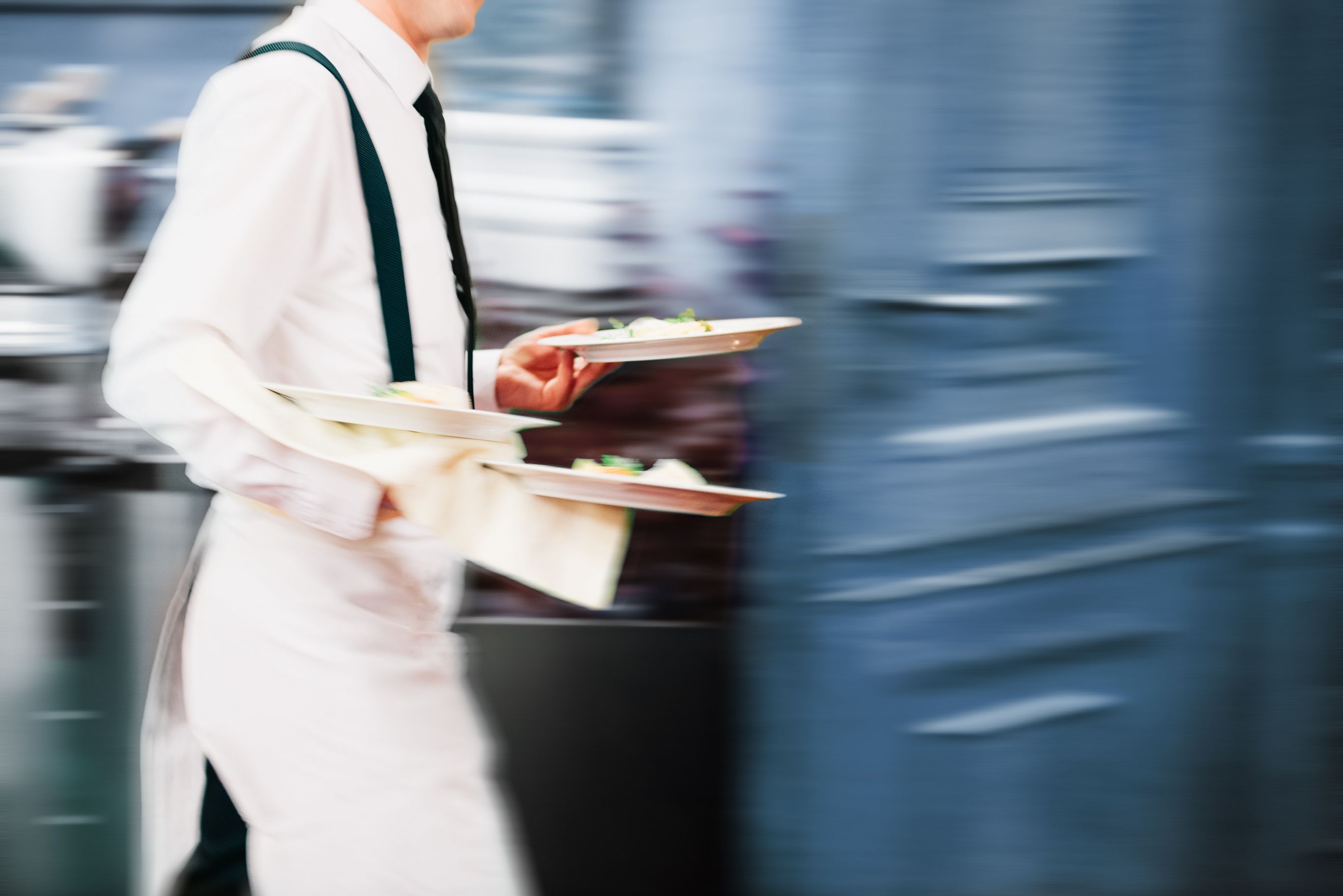 Restaurant cook carrying a plated dish