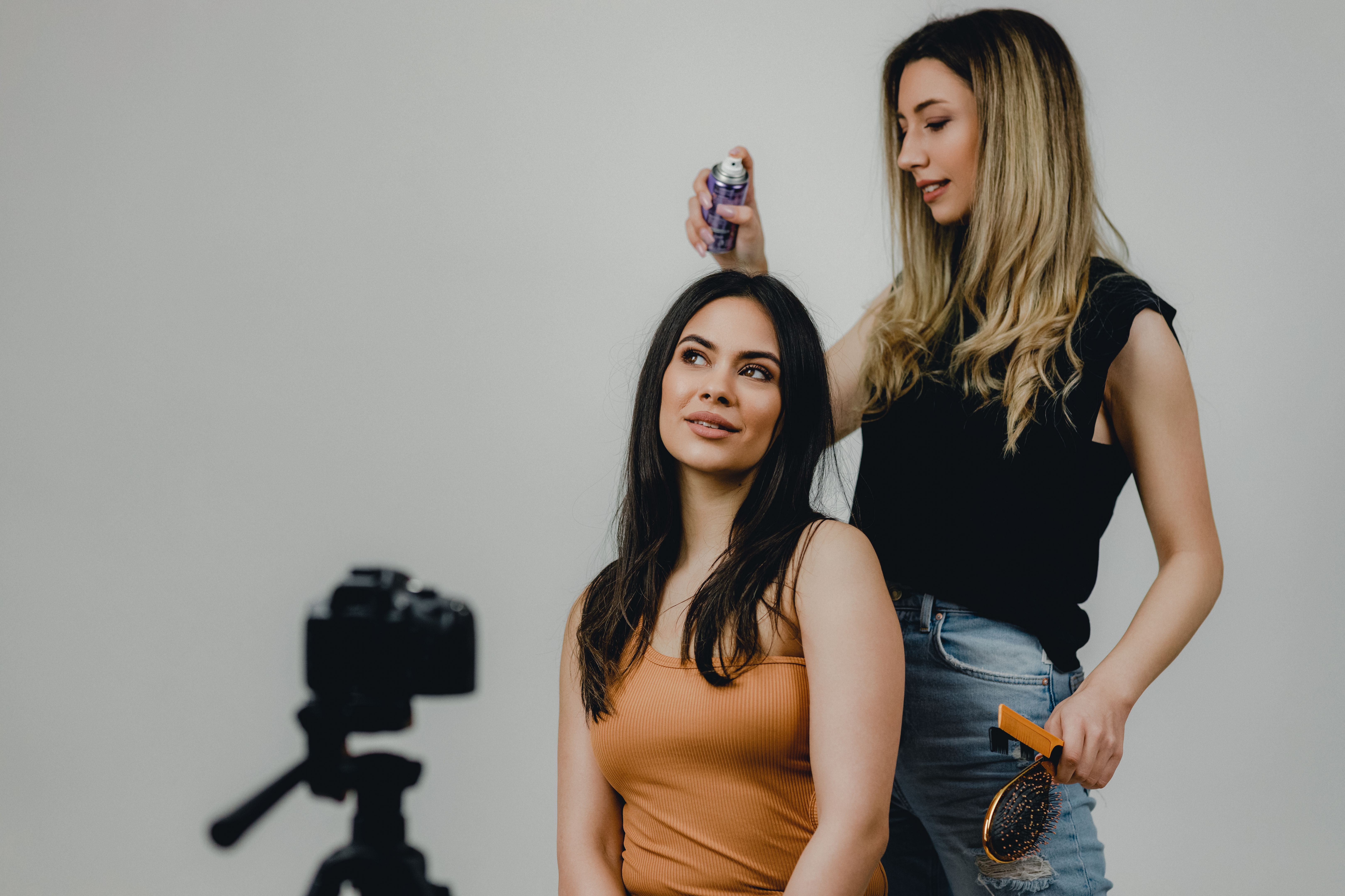 Professional Hairdresser Styling Models' Hair for the Photoshoot