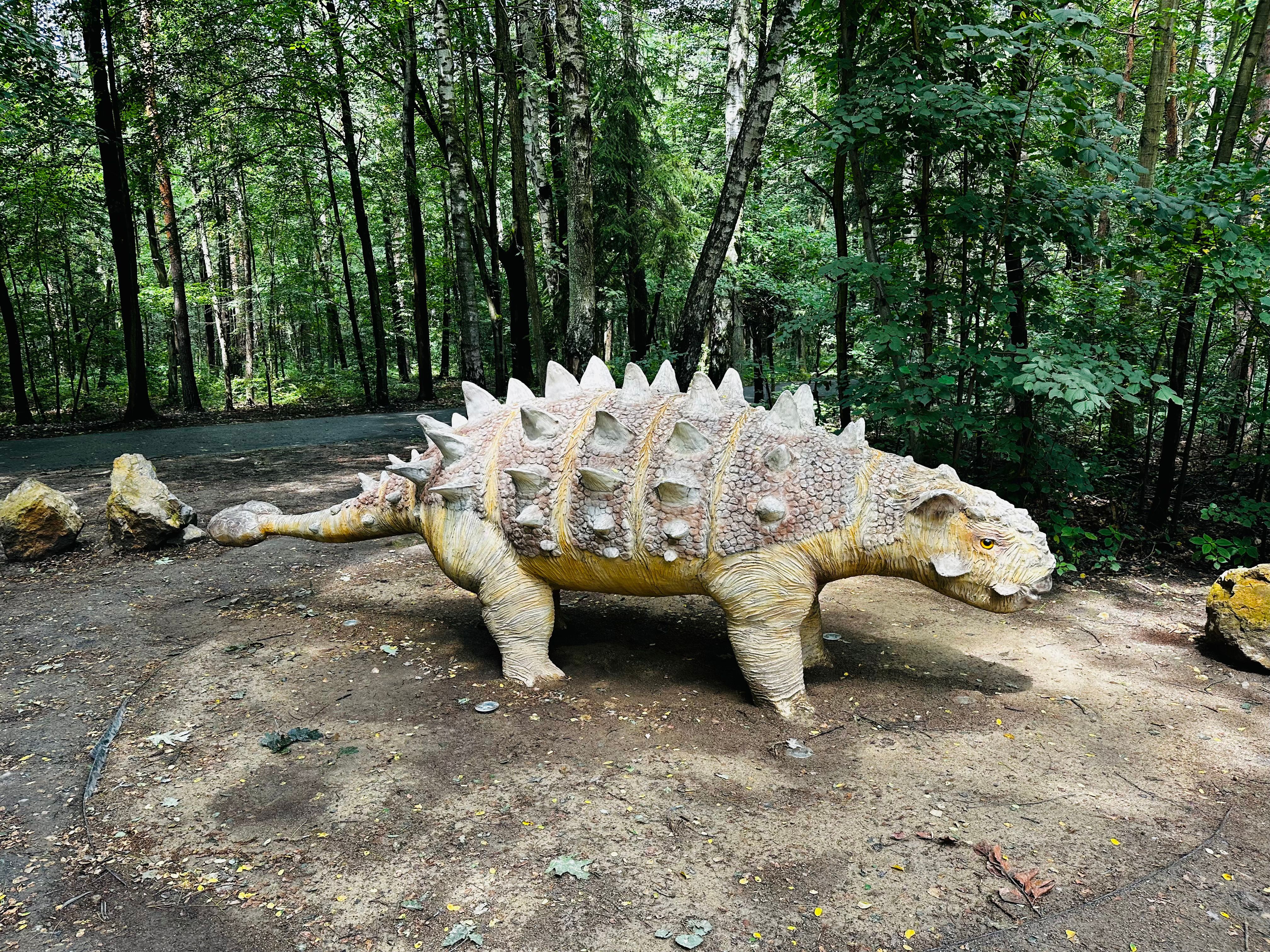 Sajchania dinosaur. Realistic figure of an Sajchania dinosaur inforest park in Kazimierz Sosnowiec. Prehistoric predator create a fascinating element of the landscape, attracting dinosaur lovers.