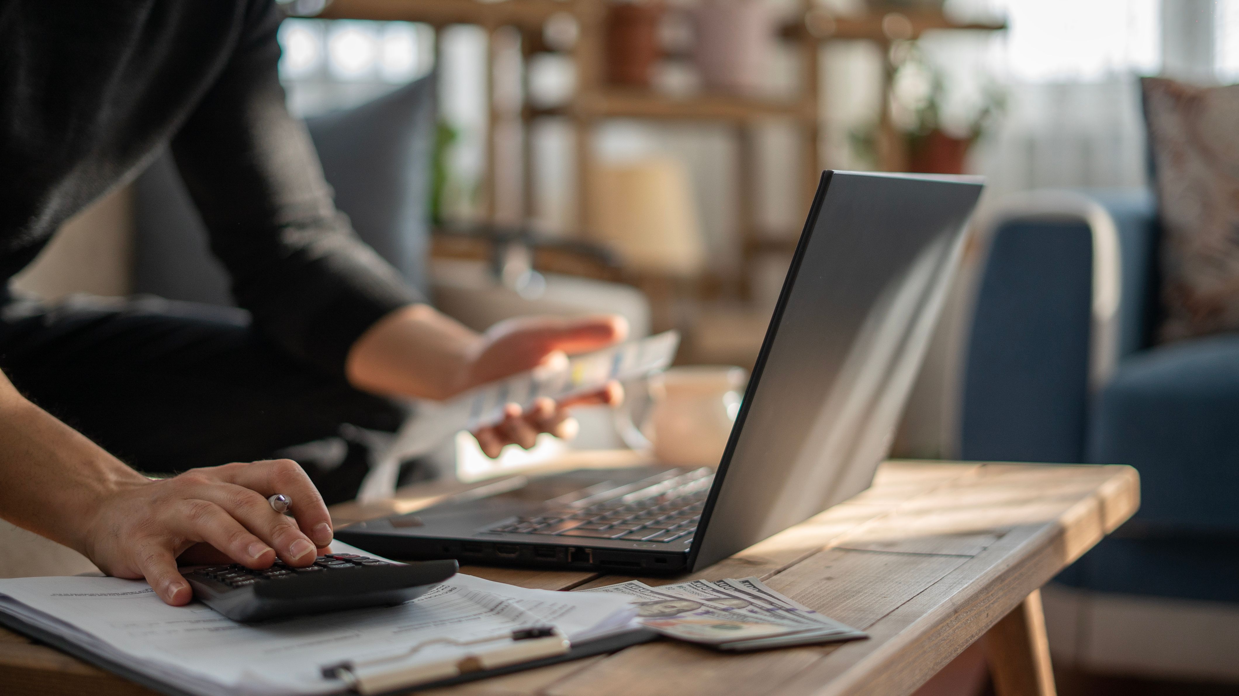 Close-up Man is calculating house bills cost
