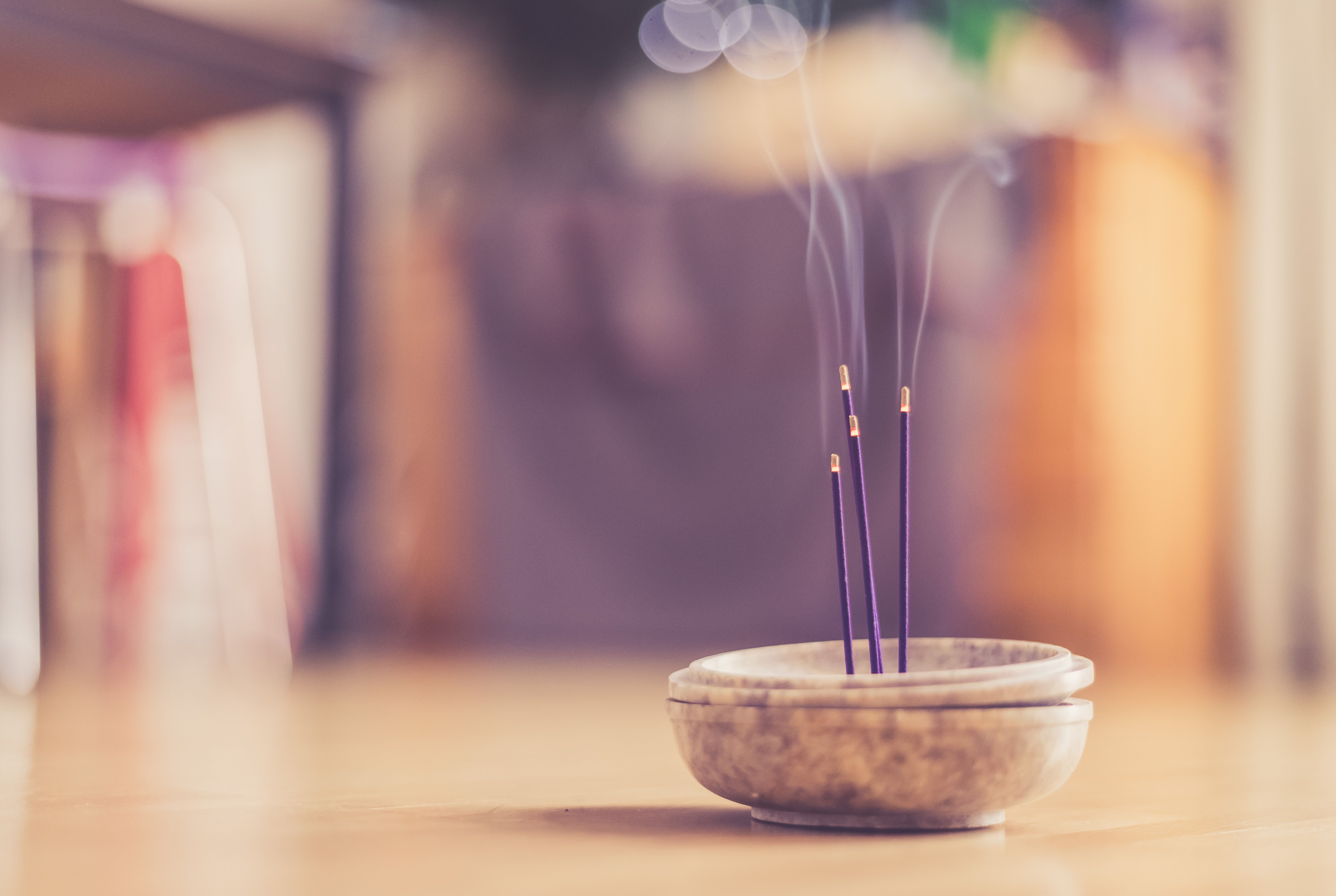 Smoking and smelling joss sticks at home, feng shui; Copy space