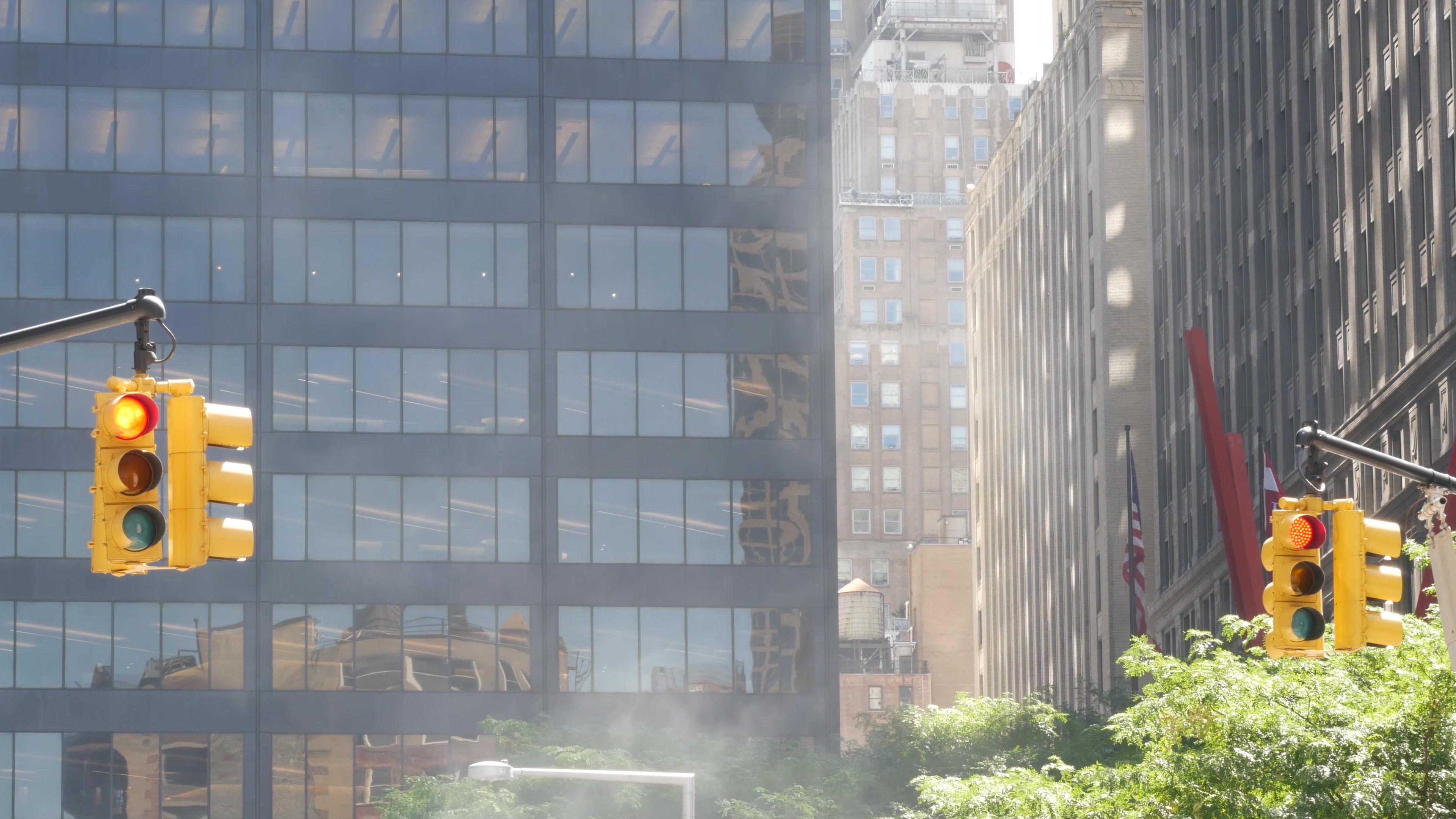 Steam vapor vented, New York City street steam system, orange vapour tube stack. Hot smoke from pipe Steam vapor vented, New York City street steam system, orange vapour tube stack. Hot smoke from pipe