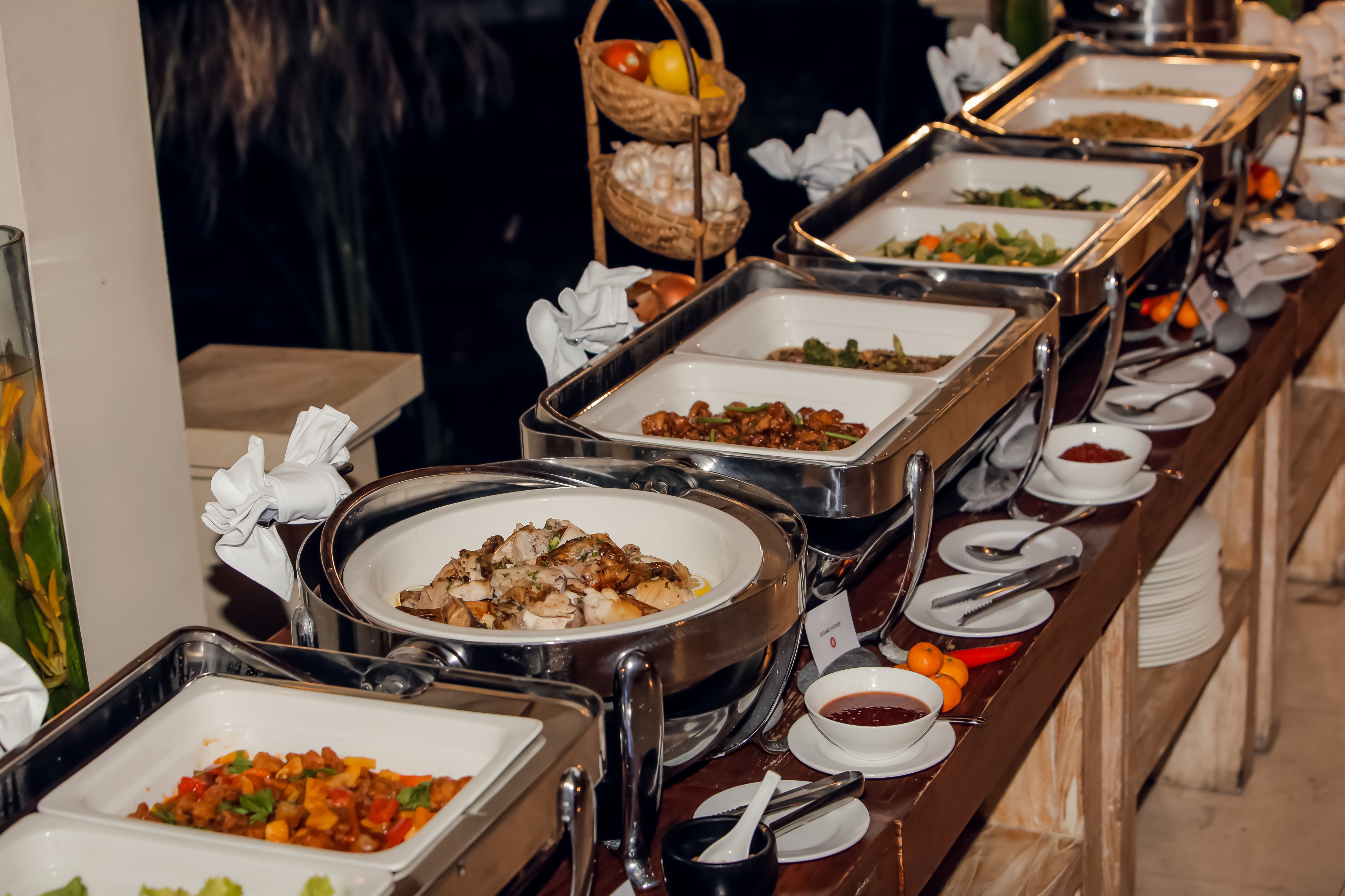 Catering banquet table with different food. Variety of snacks, appetizers, seafood and cooked meals displayed as buffet for wedding, Christmas, business corporate, birthday party or other event