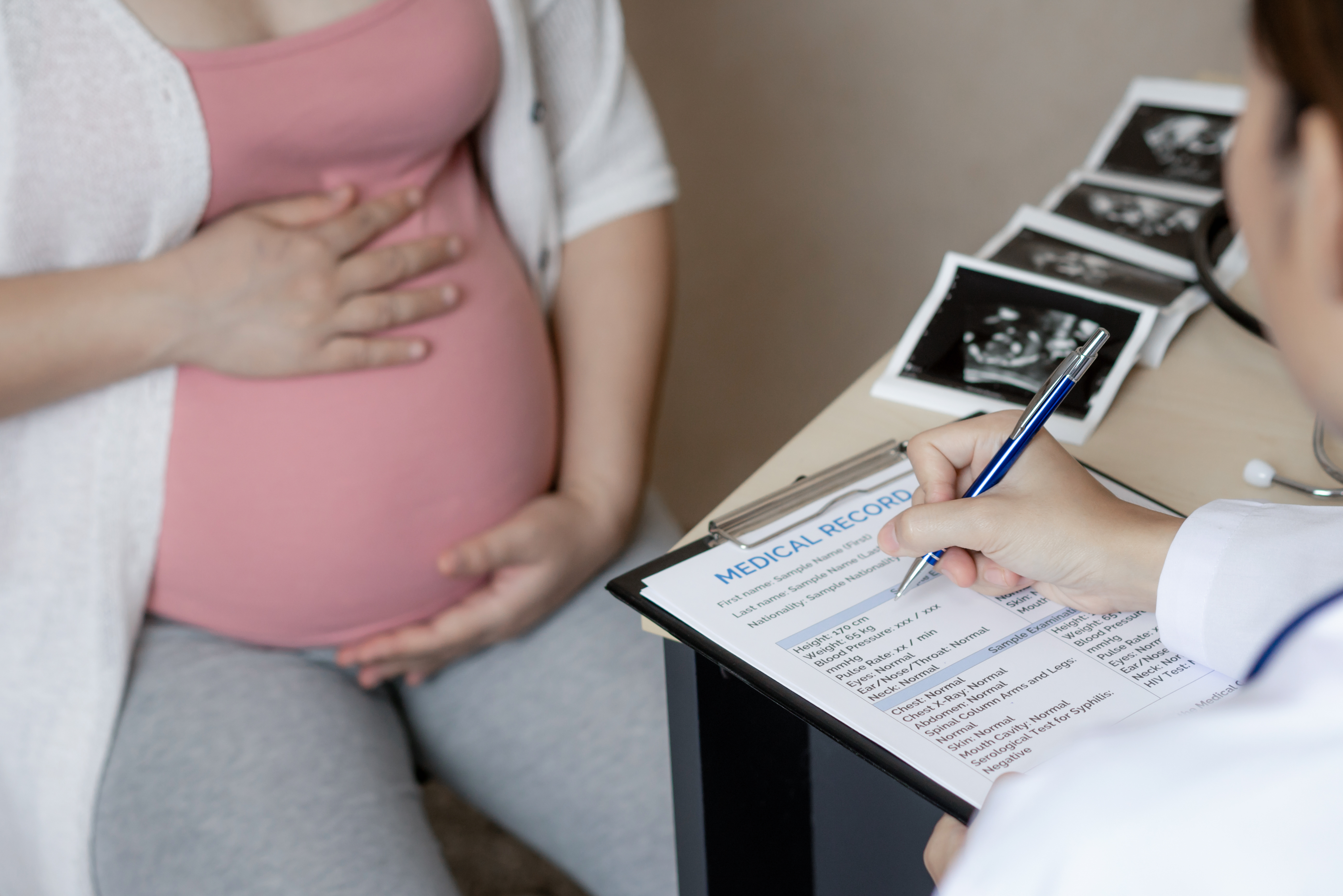 Pregnant Woman and Gynecologist Doctor at Hospital Pregnant Woman and Gynecologist Doctor at Hospital