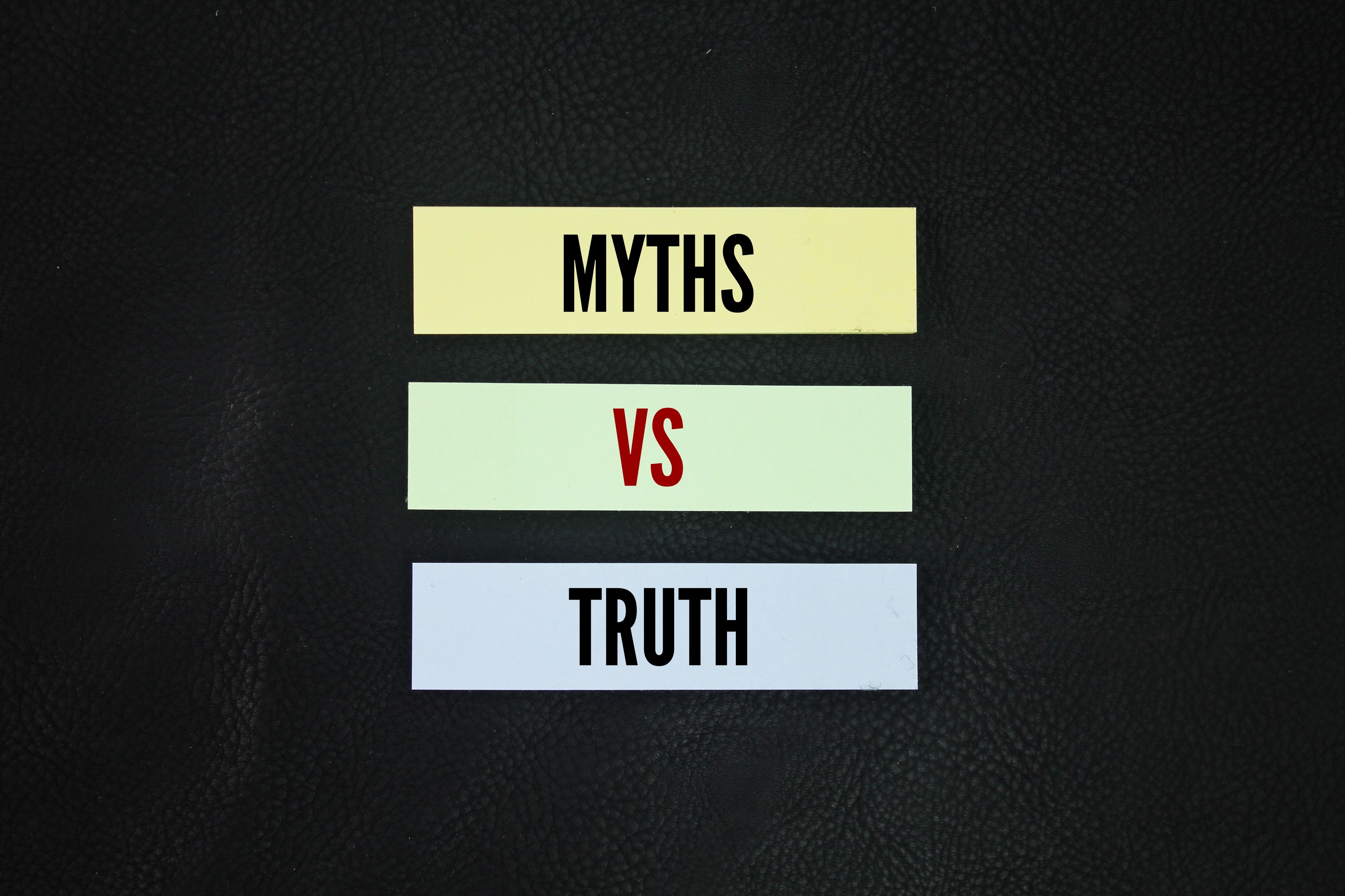 Colored paper with the words myths vs truth. The truth of myth is then a function of the interpretation of myth Colored paper with the words myths vs truth. The truth of myth is then a function of the interpretation of myth