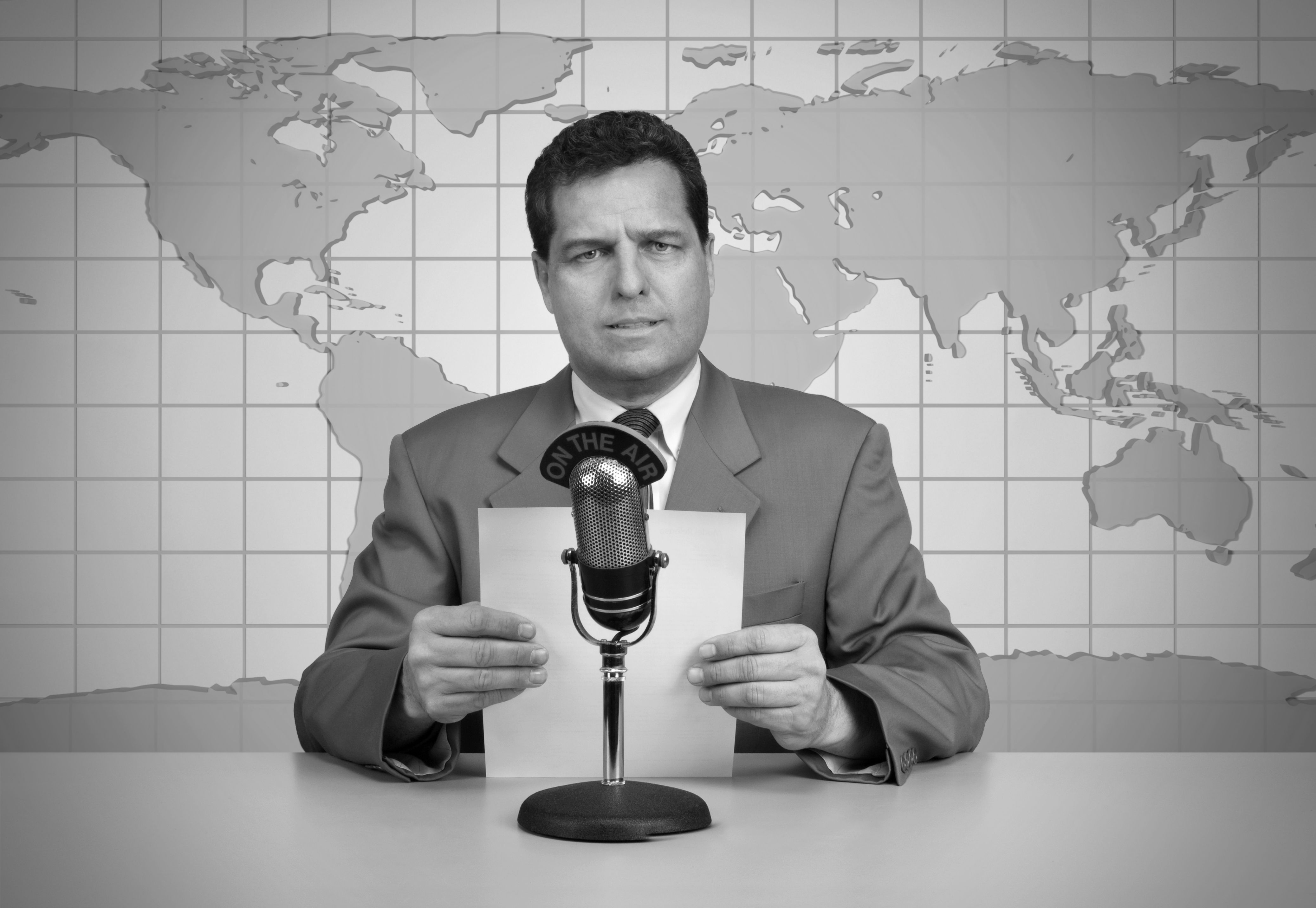 Black and white picture of a vintage newscast