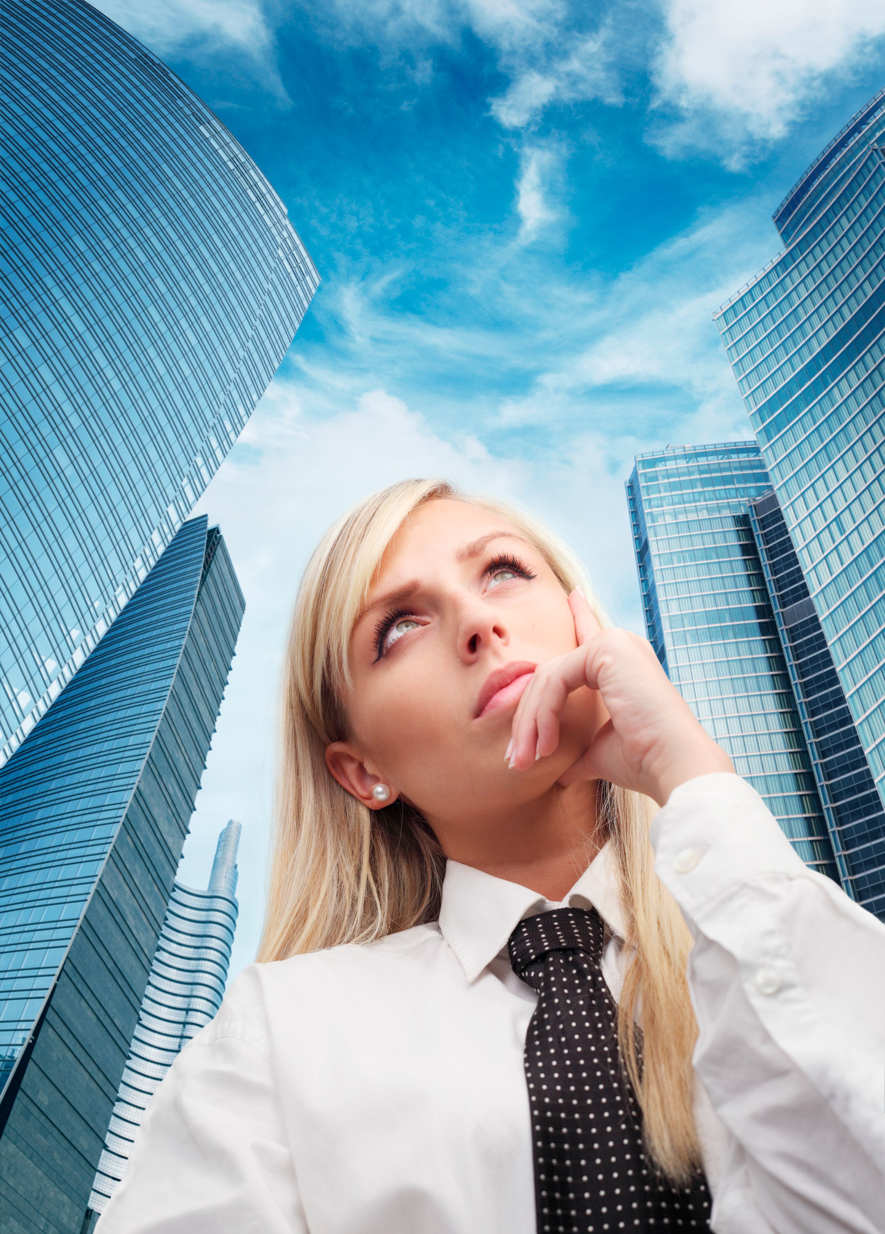 Bussines woman among the skyscrapers Bussines woman among the skyscrapers