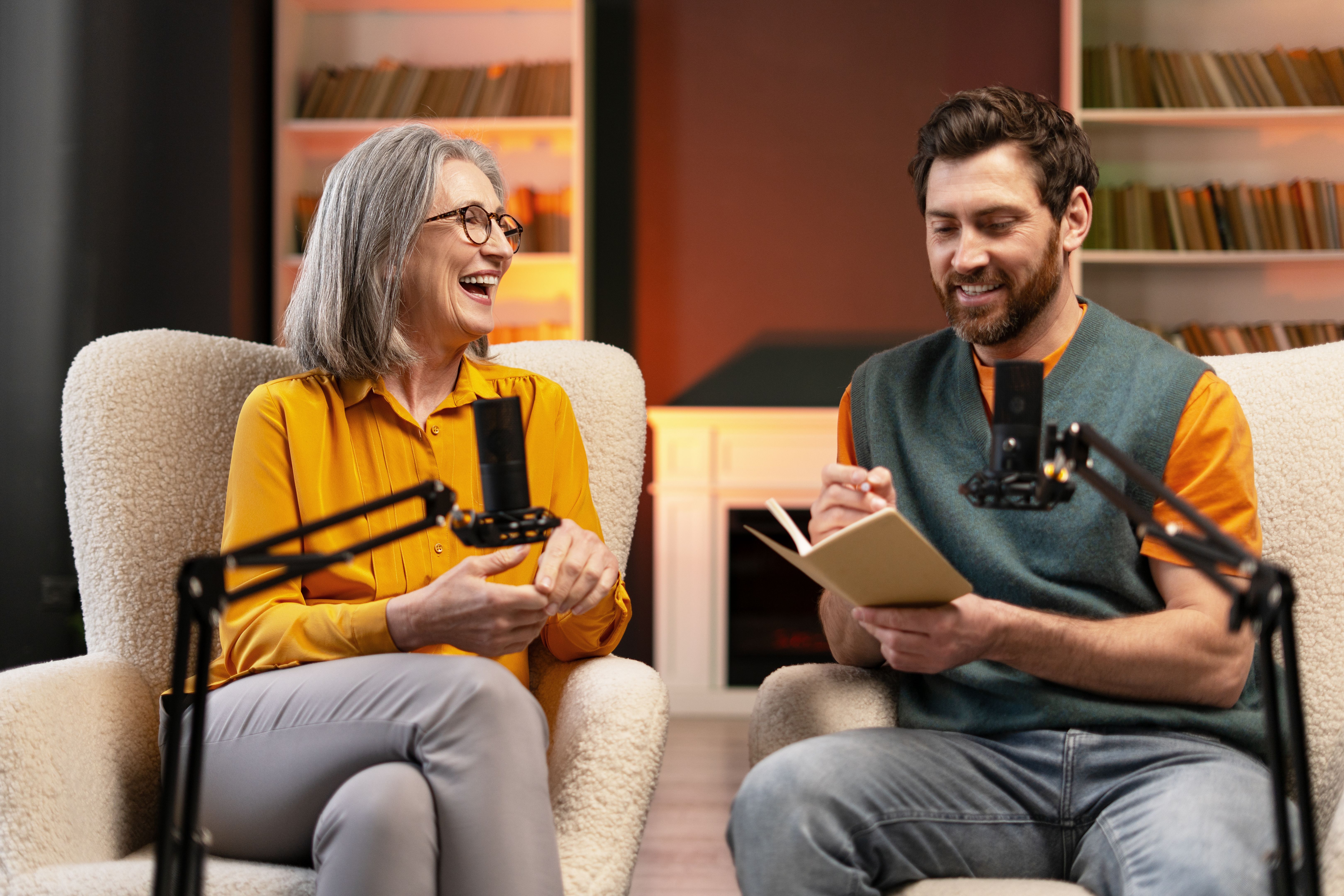 Podcasters recording an interview in a home studio