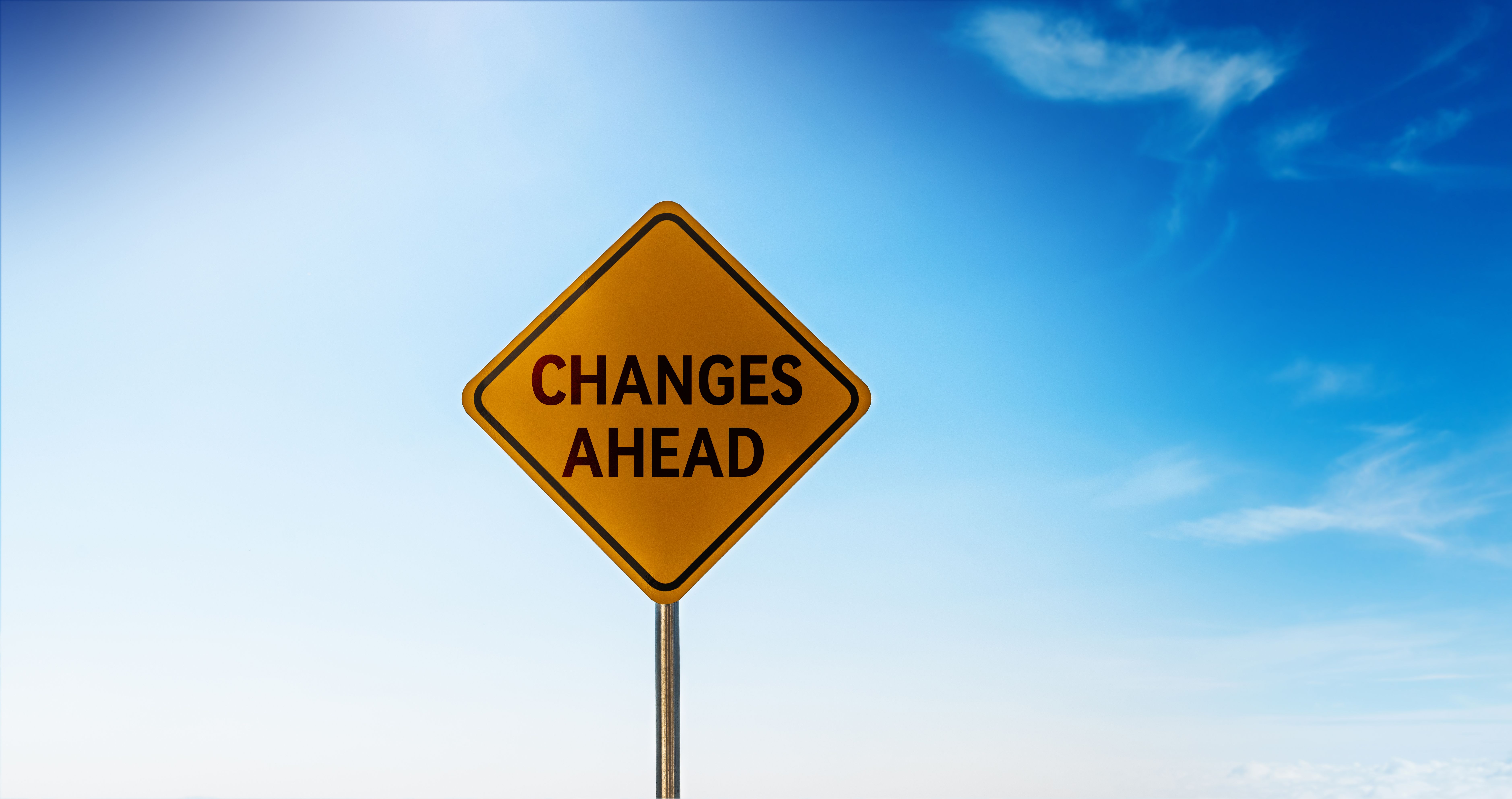 Changes ahead road sign over blue sky