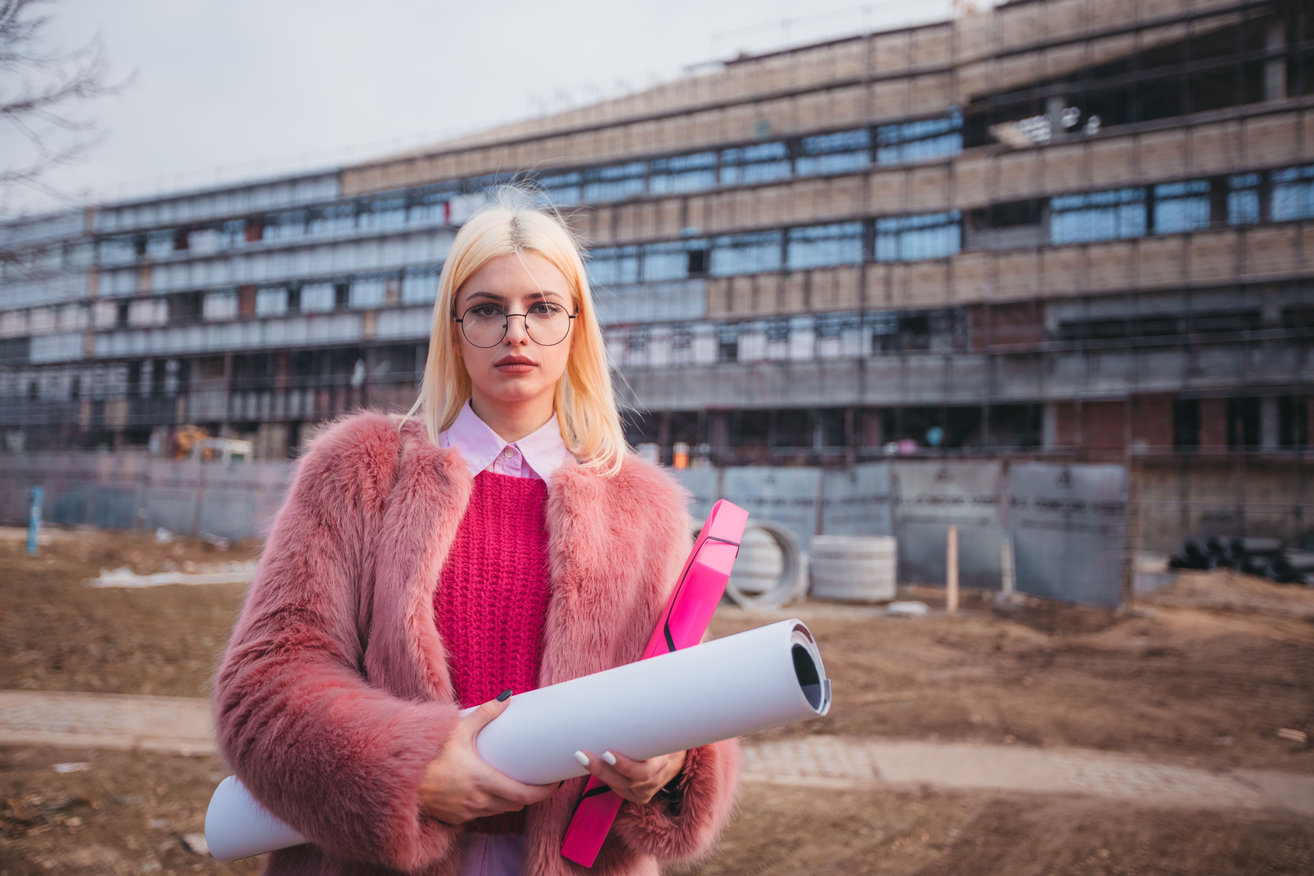 Female engineeer. Construction job site. Framed building Female engineeer. Construction job site. Framed building