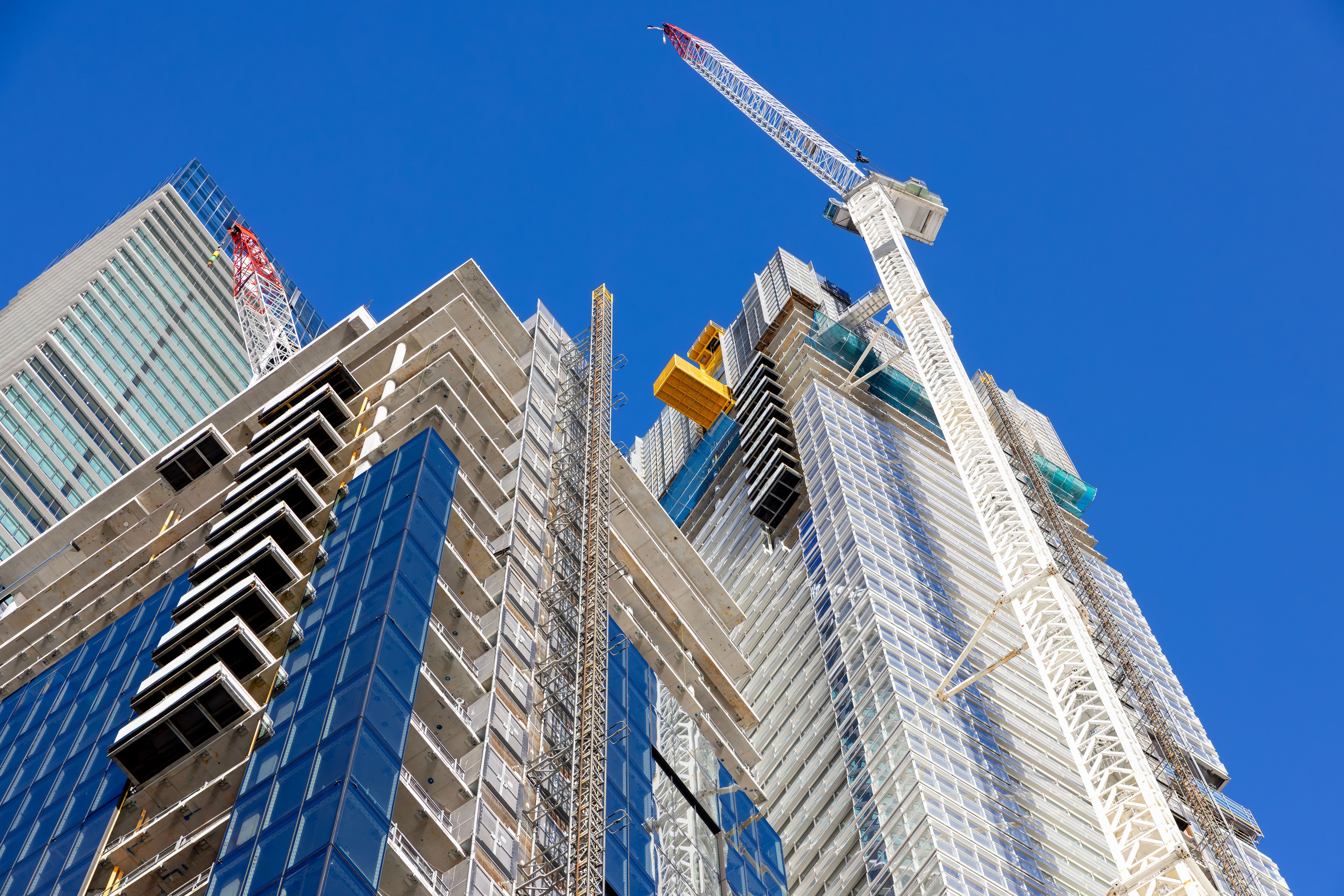 Construction of skyscrapers in the city, blue sky background with copy space