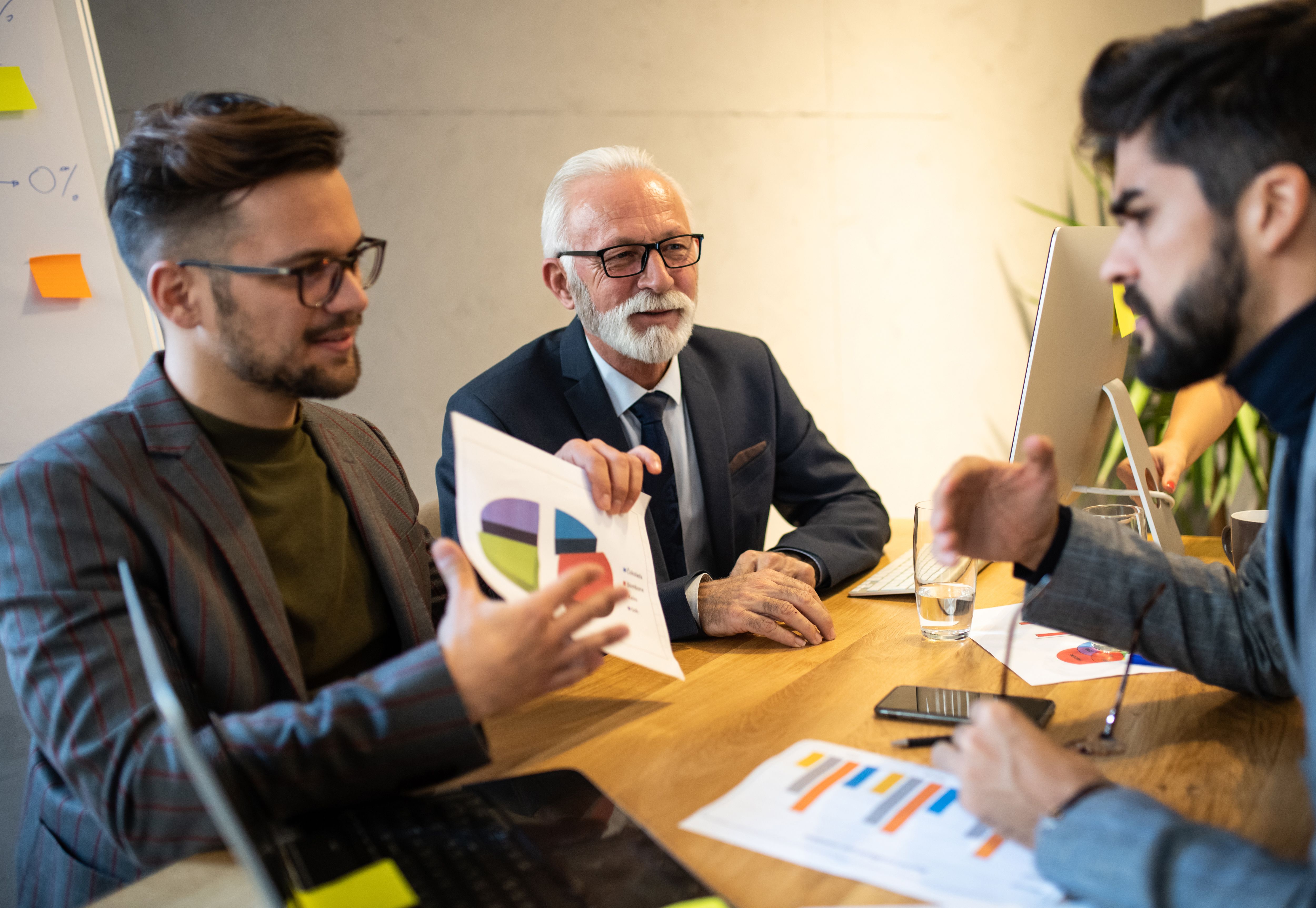 Businessmen talking about their progress so far.