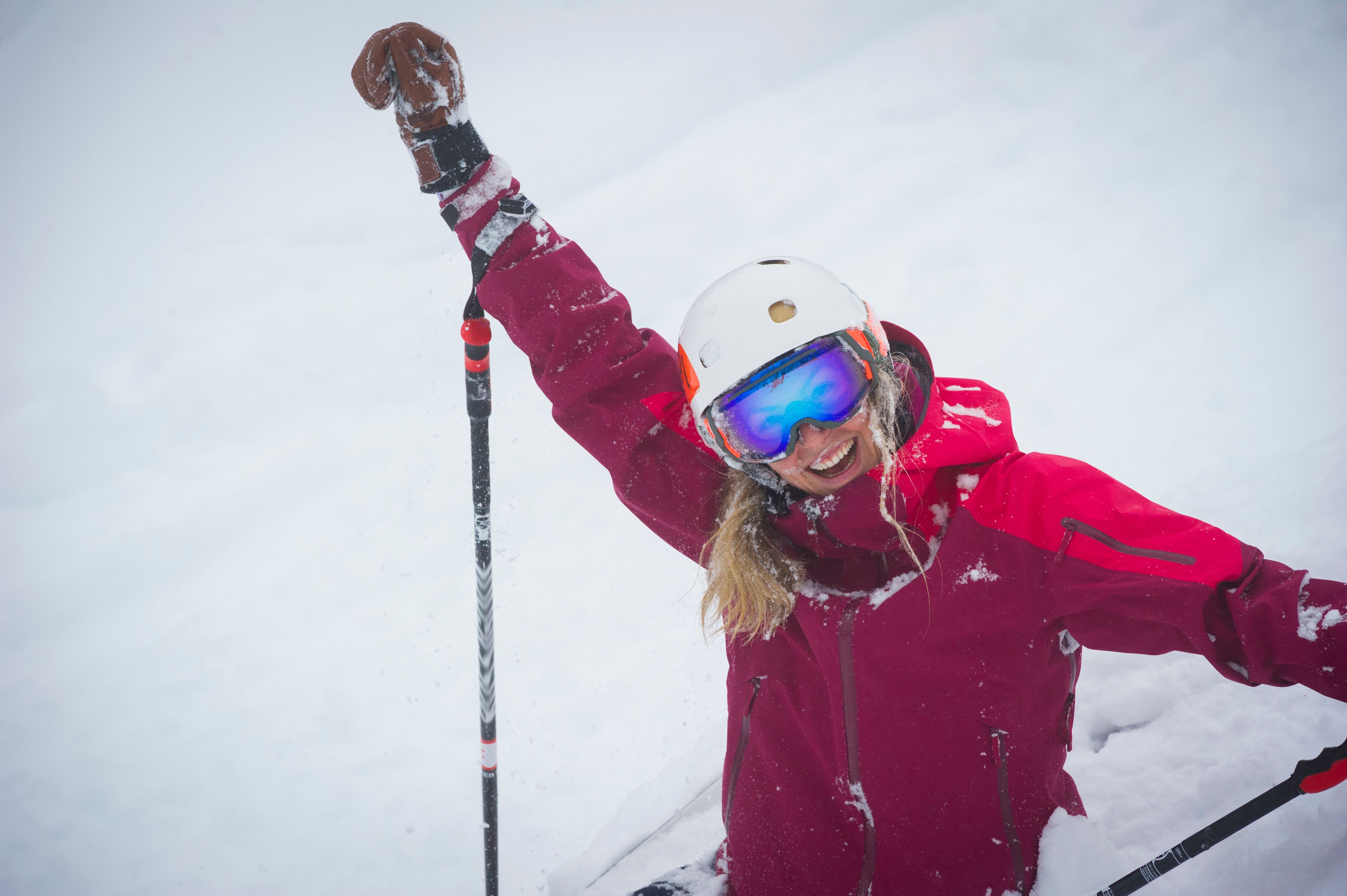 Portrait of woman skier in fresh powder snow
