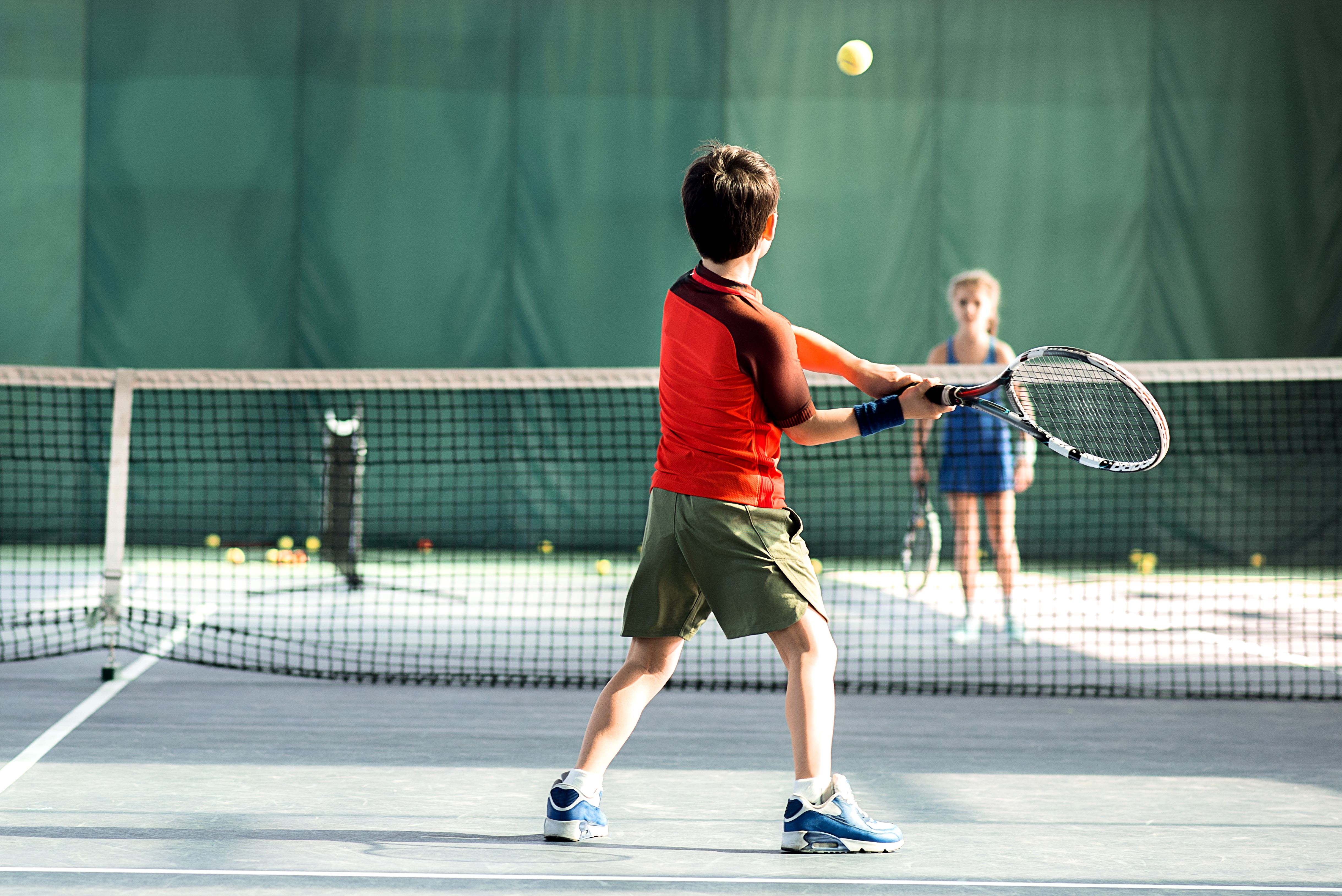 children playing tennis