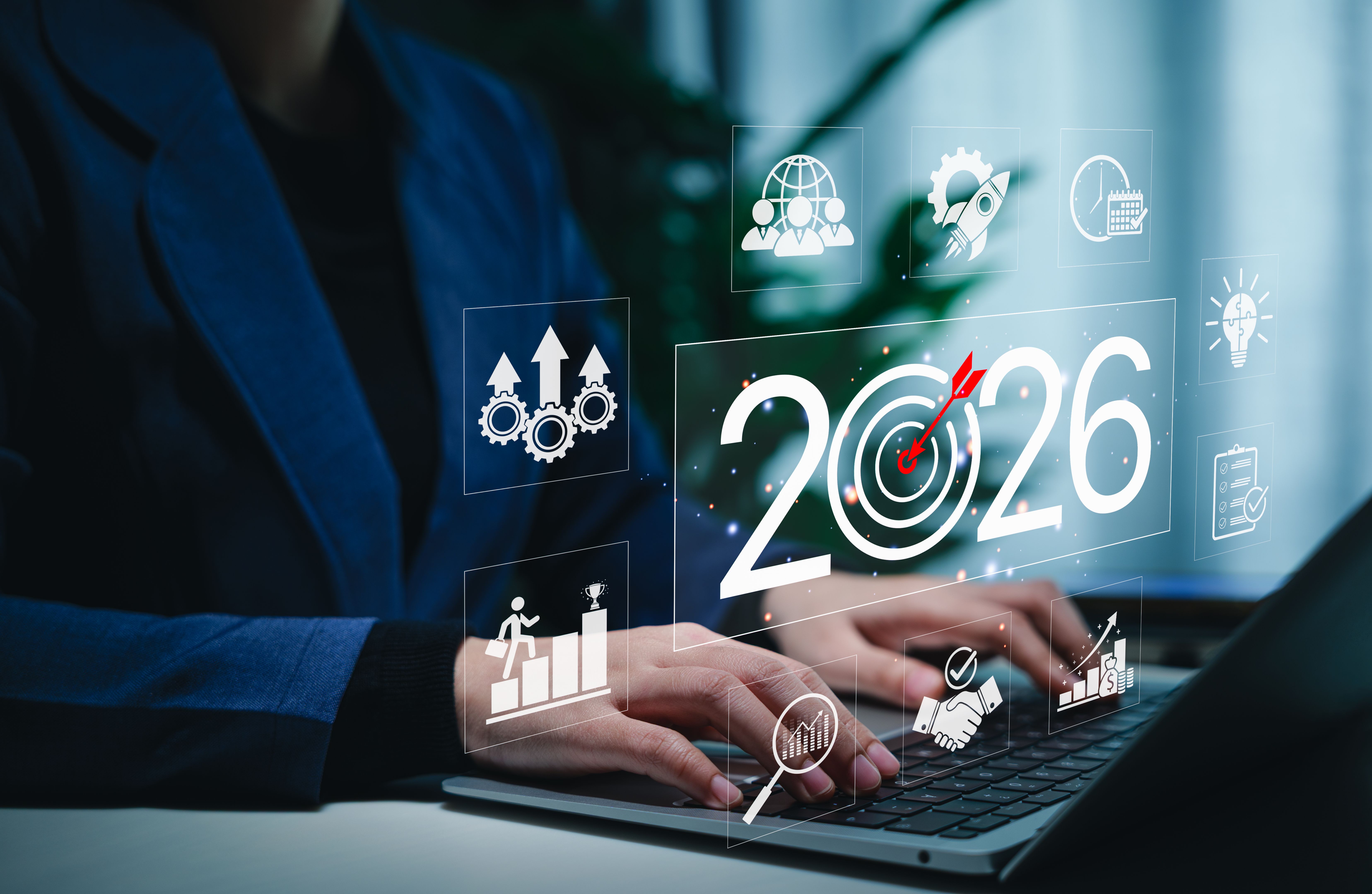 Business Goals and Growth Strategy for 2026 Concept. Businessperson working on a laptop with the year 2026, target icons, and business growth symbols, challenges strategic planning and future success.
