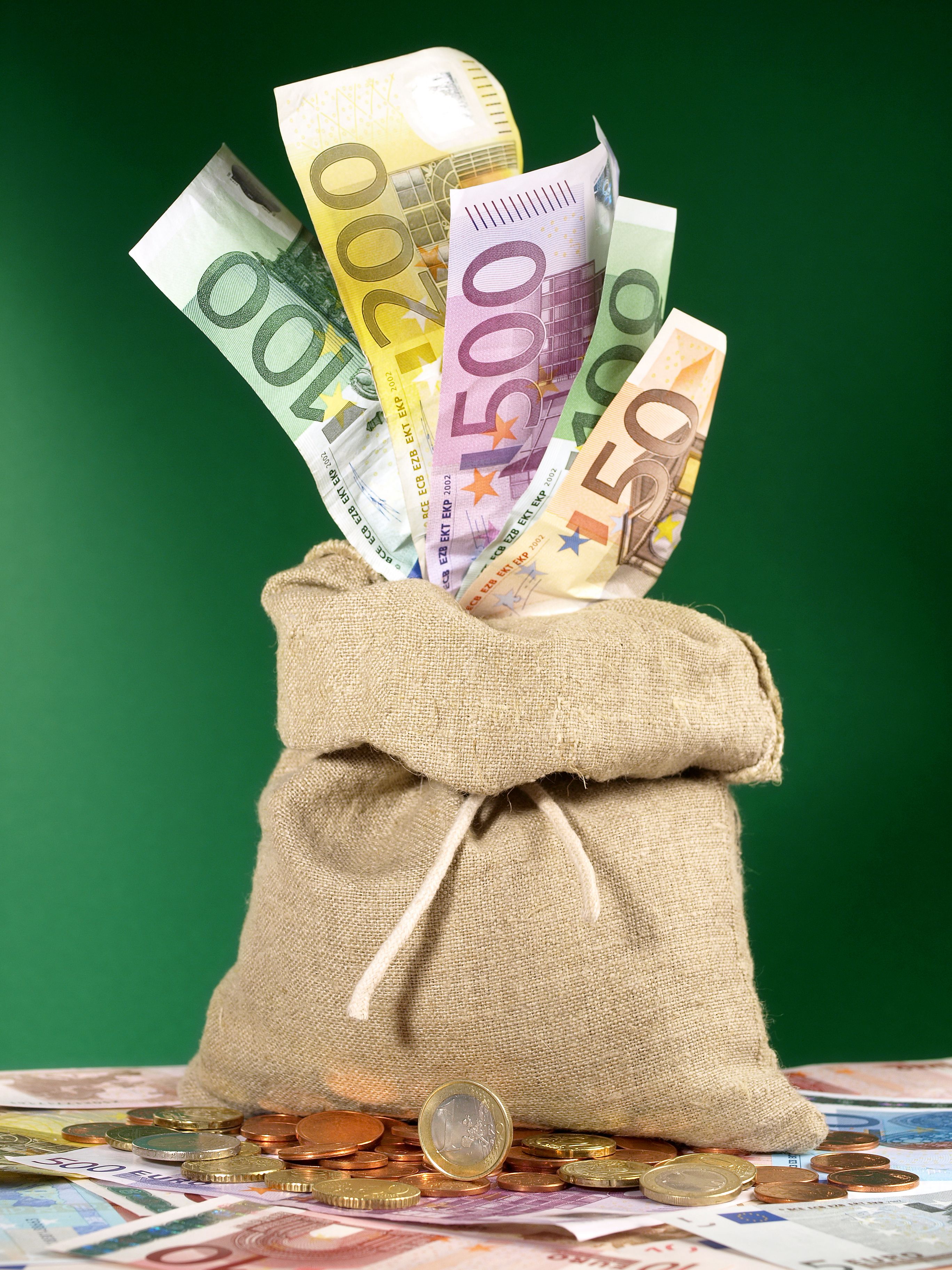 Moneybag on green Background with EURO Banknotes