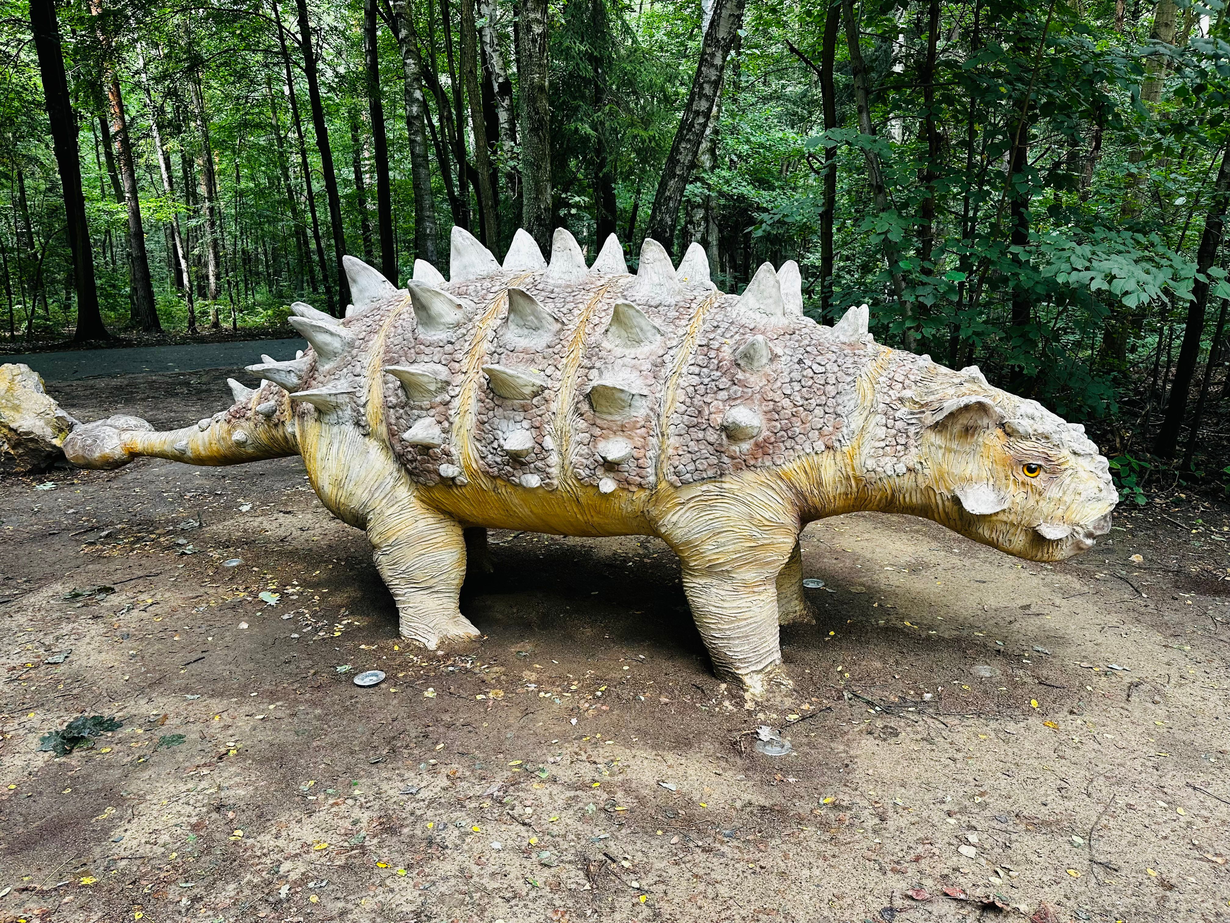 Sajchania dinosaur. Realistic figure of an Sajchania dinosaur in forest park in Sosnowiec,Poland. Prehistoric predator create a fascinating element of the landscape, attracting dinosaur lovers.