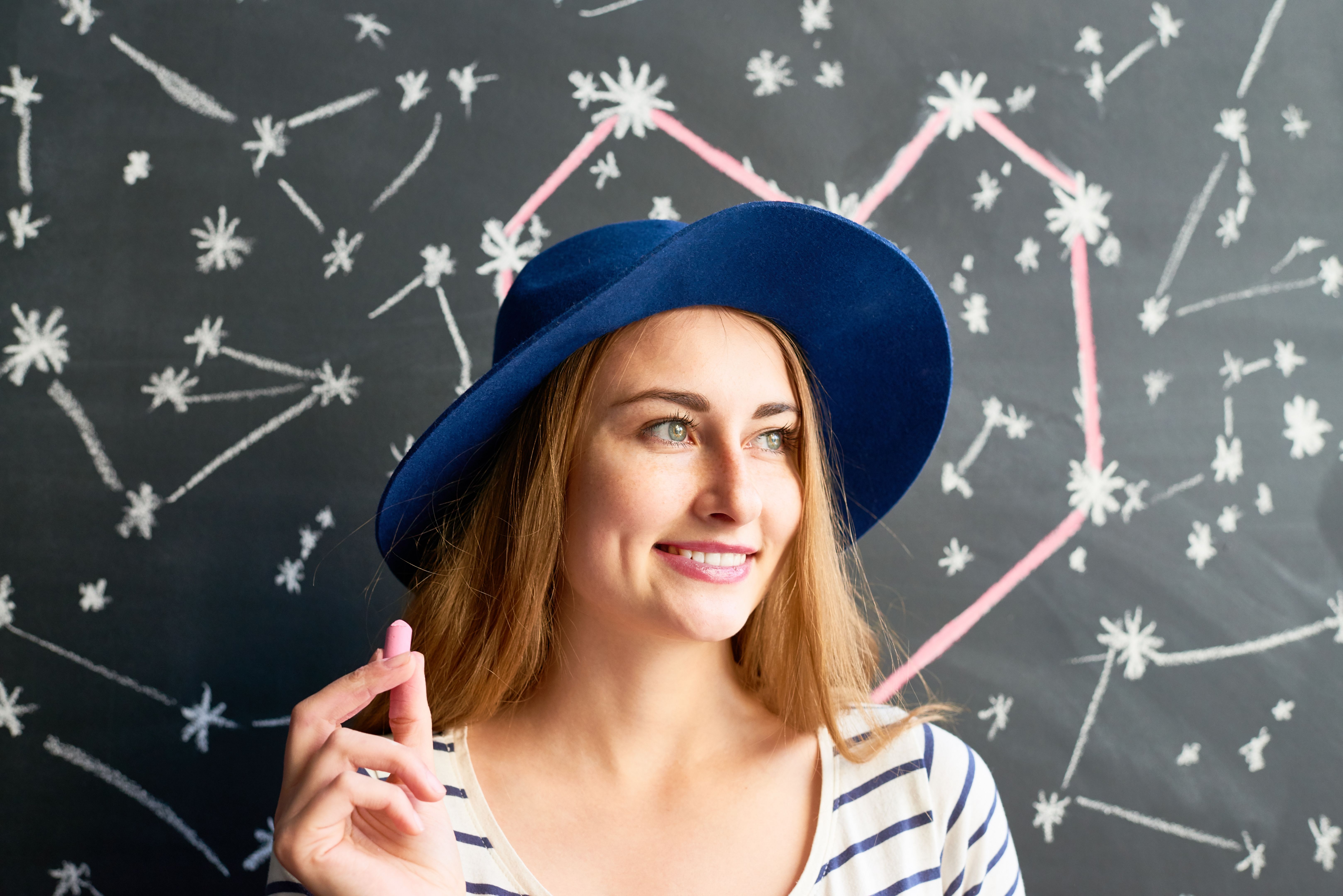 Woman drawing on the blackboard