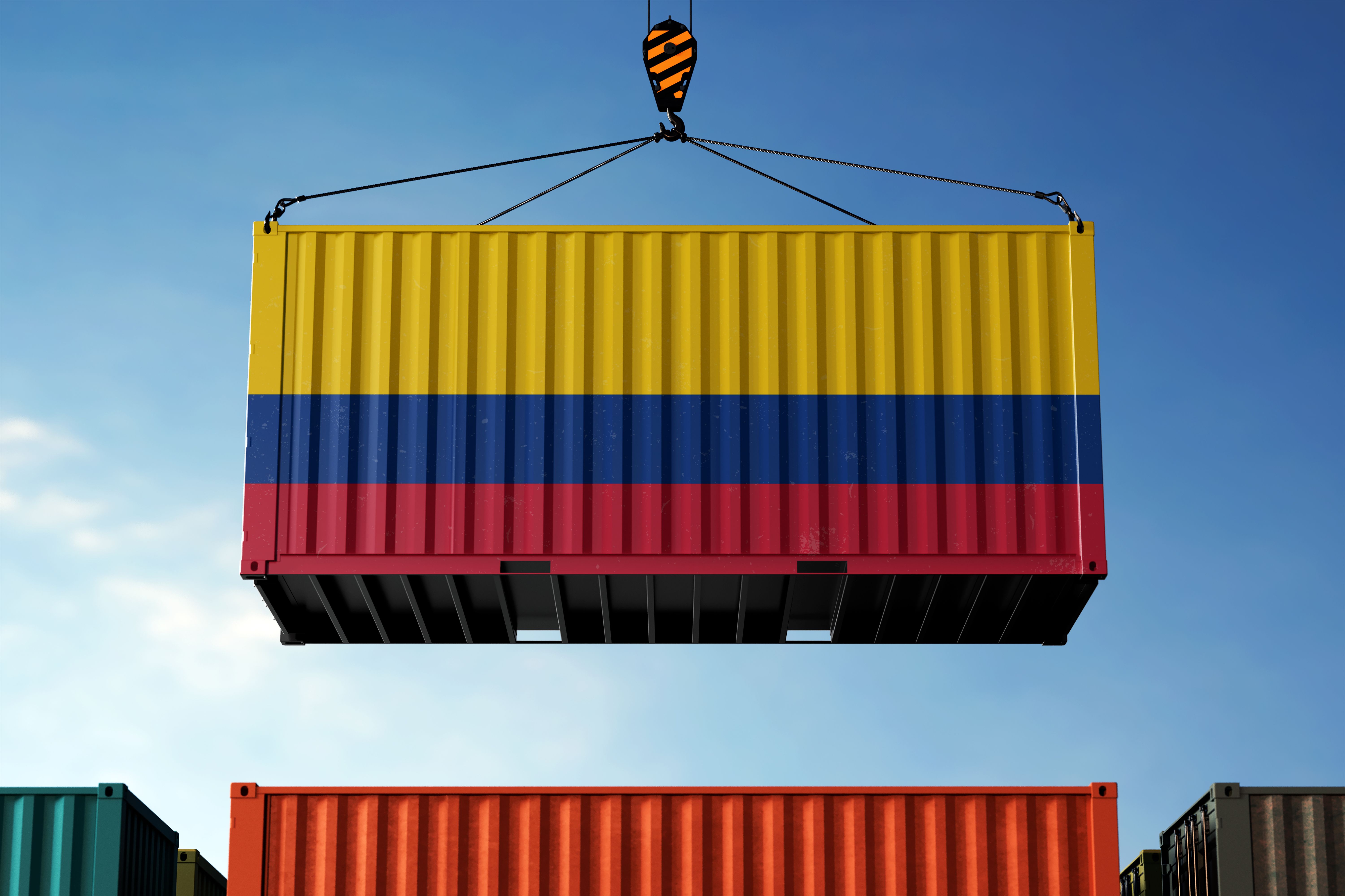 Colombia trade cargo container hanging against clouds background
