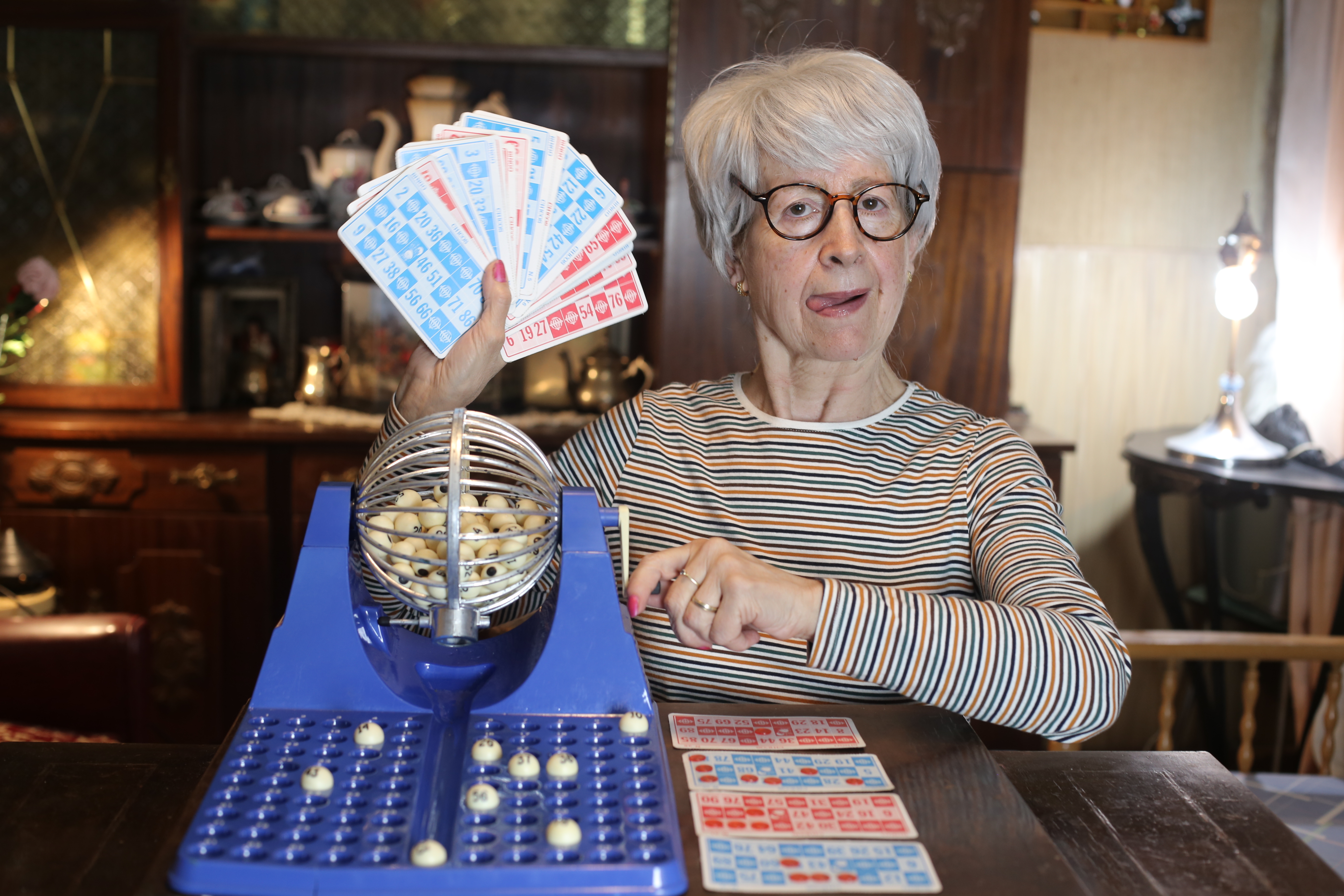 Senior woman playing some bingo Senior woman playing some bingo
